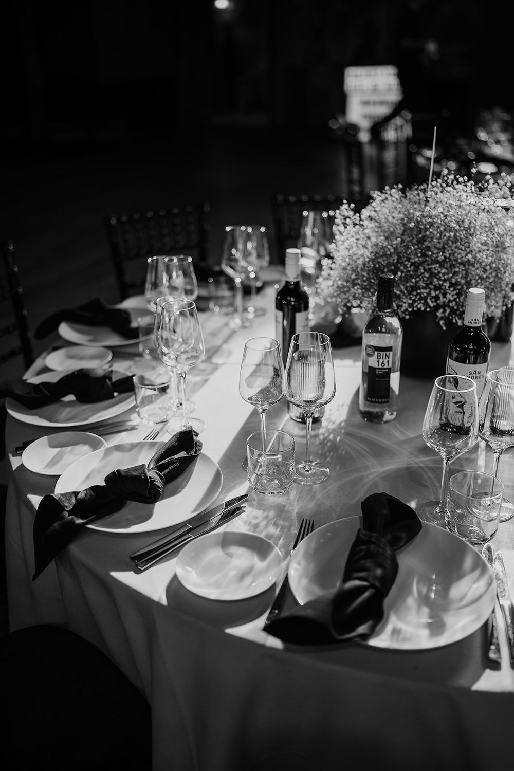 Wedding reception tables styled with monochrome colours at Battersea Arts Centre.