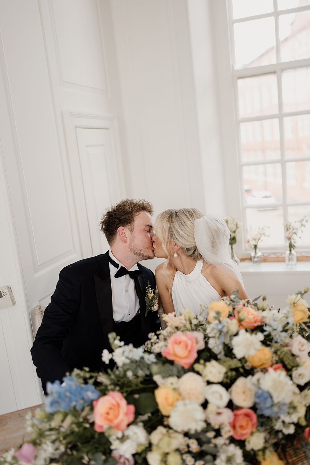 Cool couple moment: Bride and groom kissing after vows at The Secret Tower Newcastle.