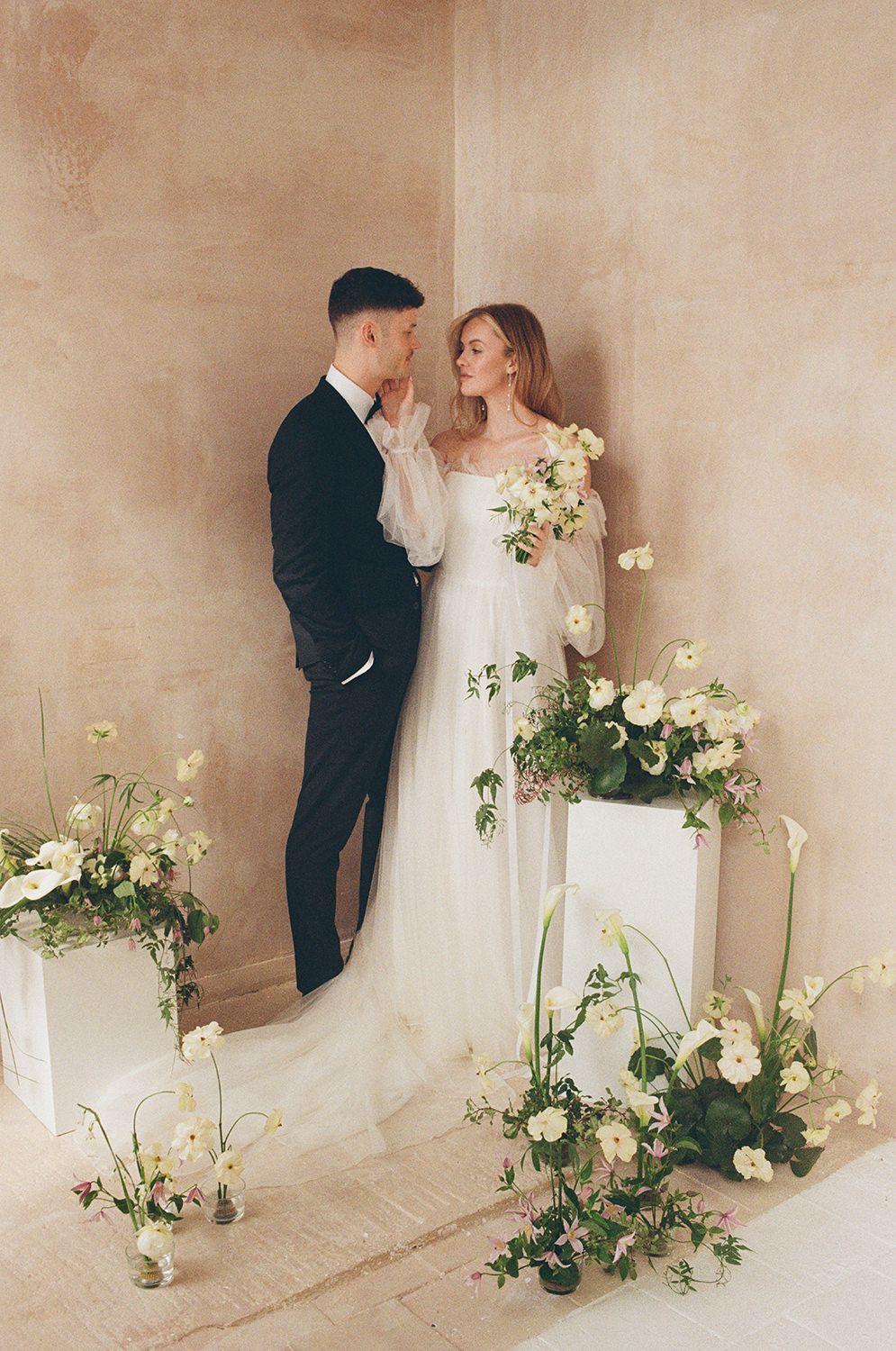 Couple in Ibiza on their wedding day cuddling each other.