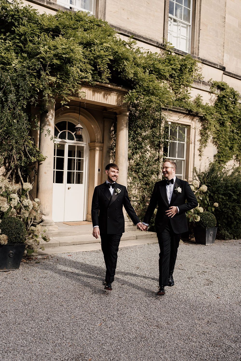 The newlyweds walking hand in hand through the estate’s gardens, making the most of golden hour.