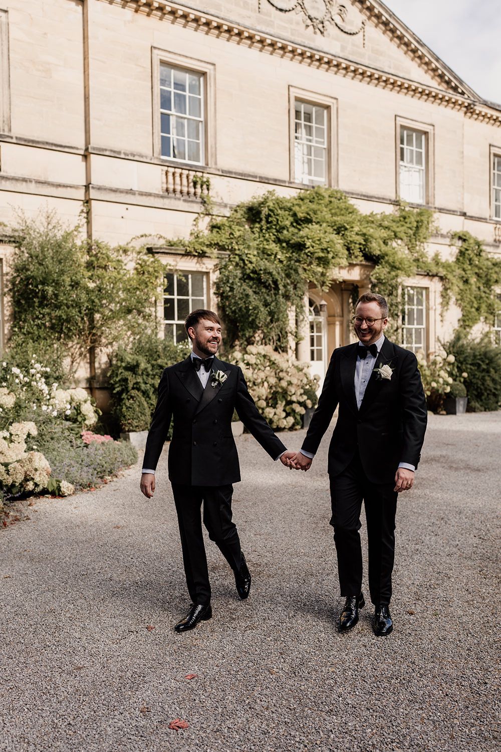 The newlyweds walking hand in hand through the estate’s gardens, making the most of golden hour.