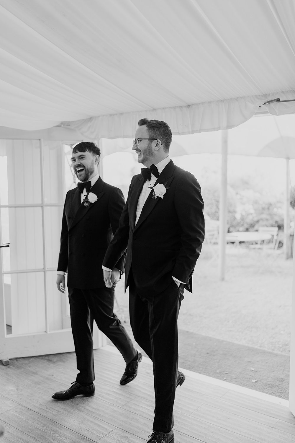 Grooms welcomed into their wedding reception at Middleton Lodge Estate.