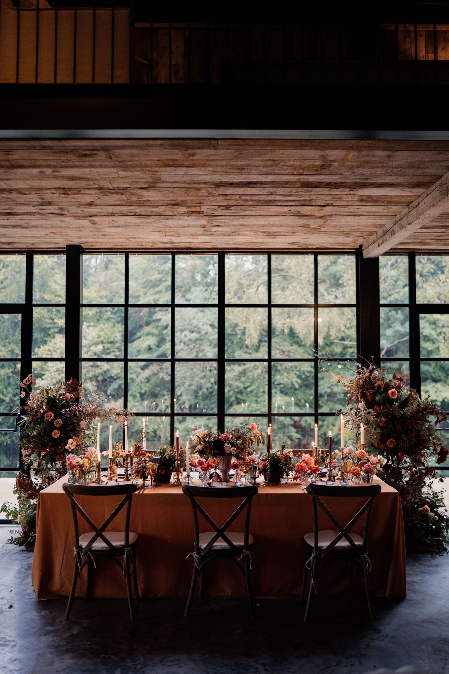 Autumnal themed wedding table styled in the middle of Hidden River Barn.