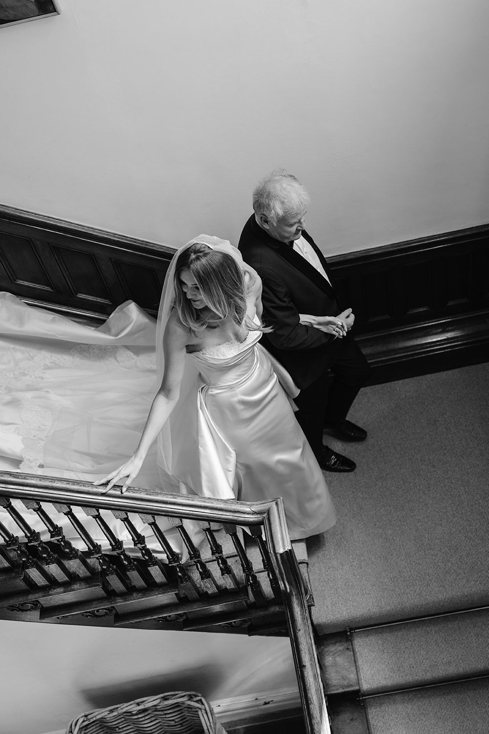A black and white artistic photo series showing someone in a white dress climbing up a ladder in sequential frames.