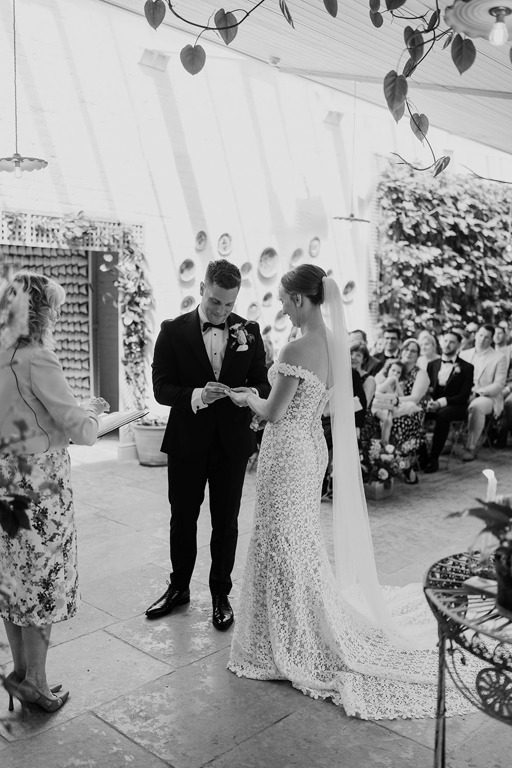 Bride and Groom exchange rings at their wedding ceremony.