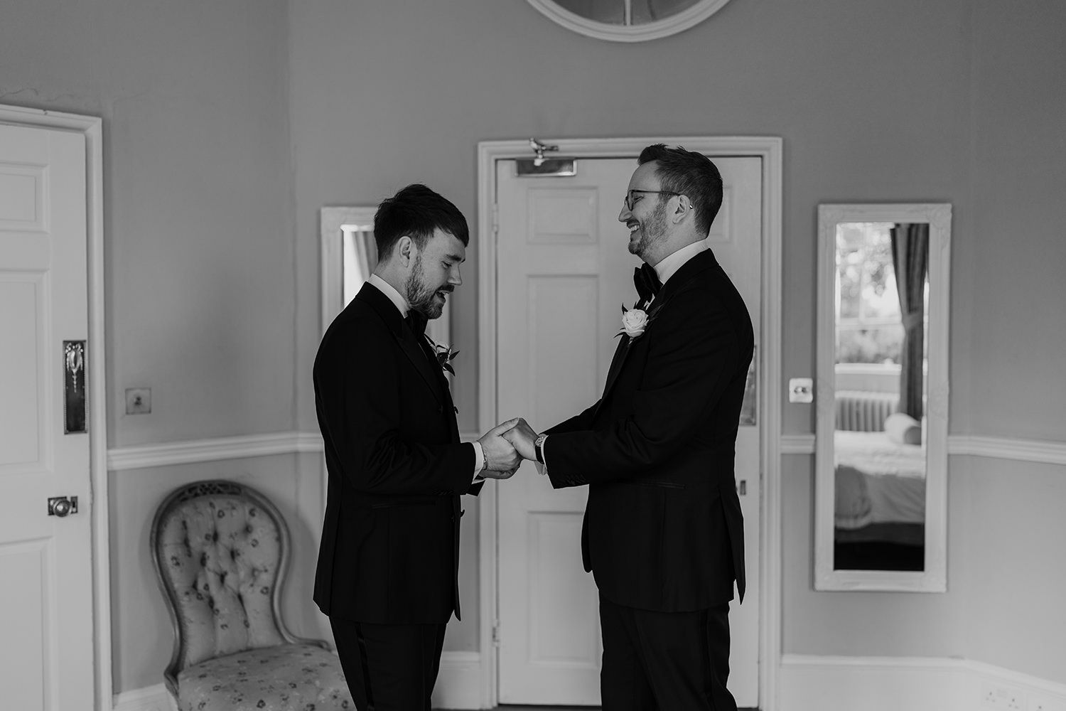 Grooms share a quiet moment together on their wedding morning at Middleton Lodge Estate.