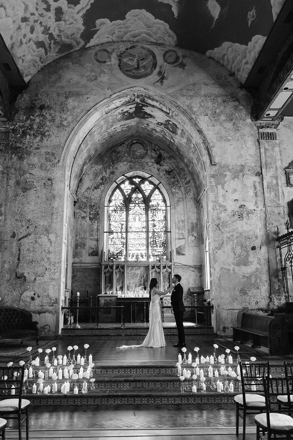 A series of black and white photos showing the interior of a Gothic church with candles and arched windows.