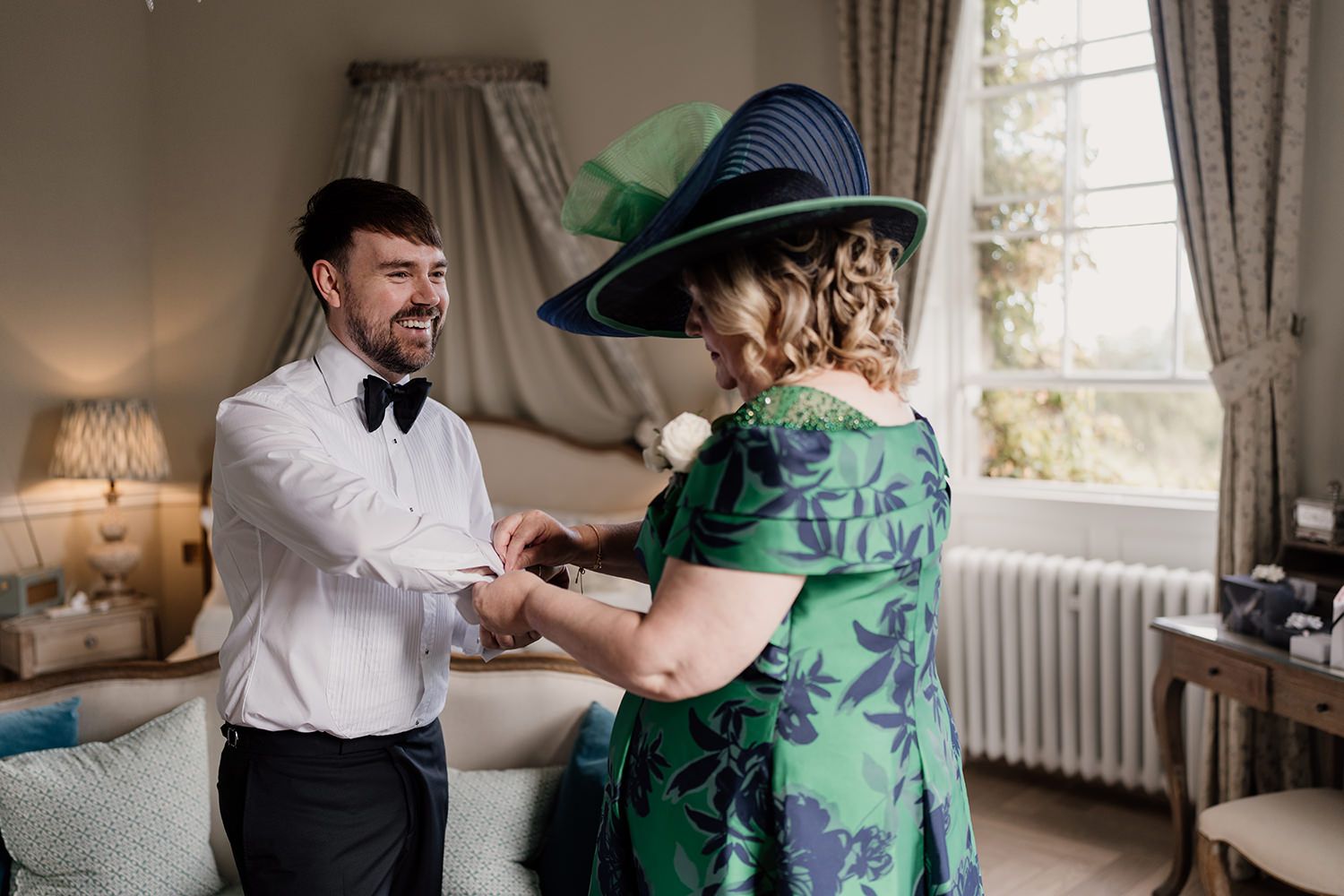 Groom and his mother getting ready on his wedding morning at Middleton Lodge Estate.