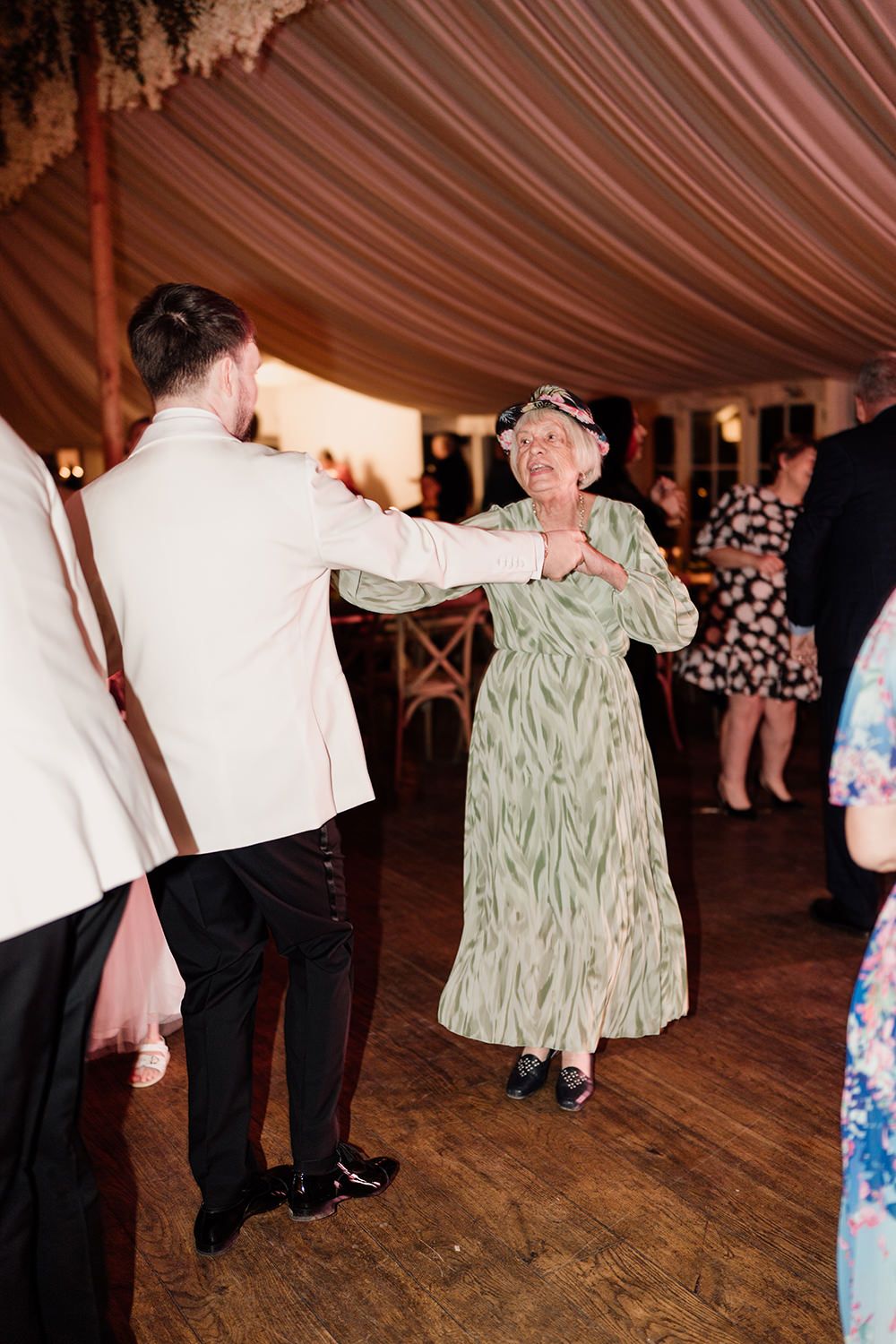 Guest Wedding Photography: Wedding guests dancing and celebrating the wedding day at Middleton Lodge Estate.