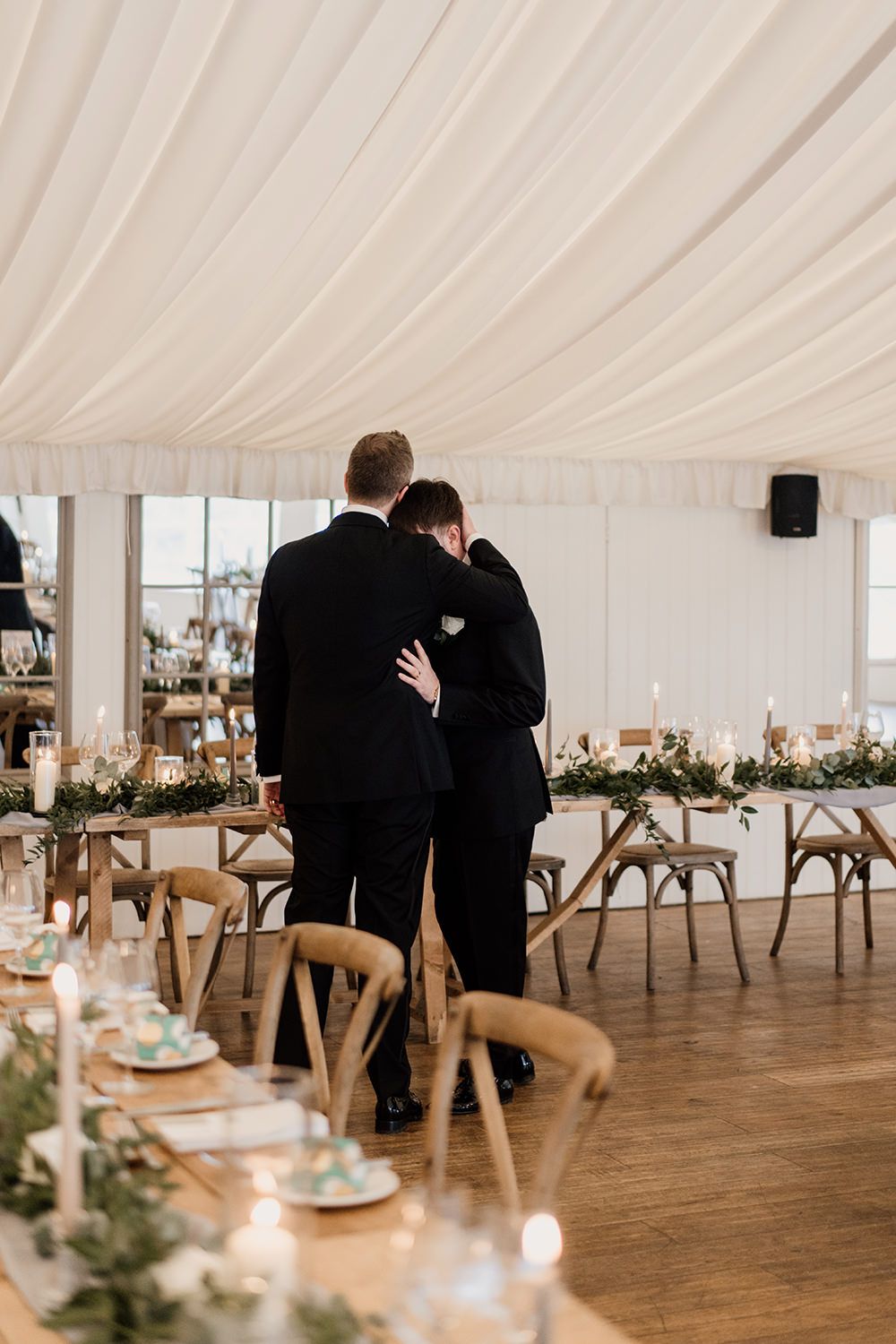 Grooms share a quiet moment together on their wedding day at Middleton Lodge Estate.