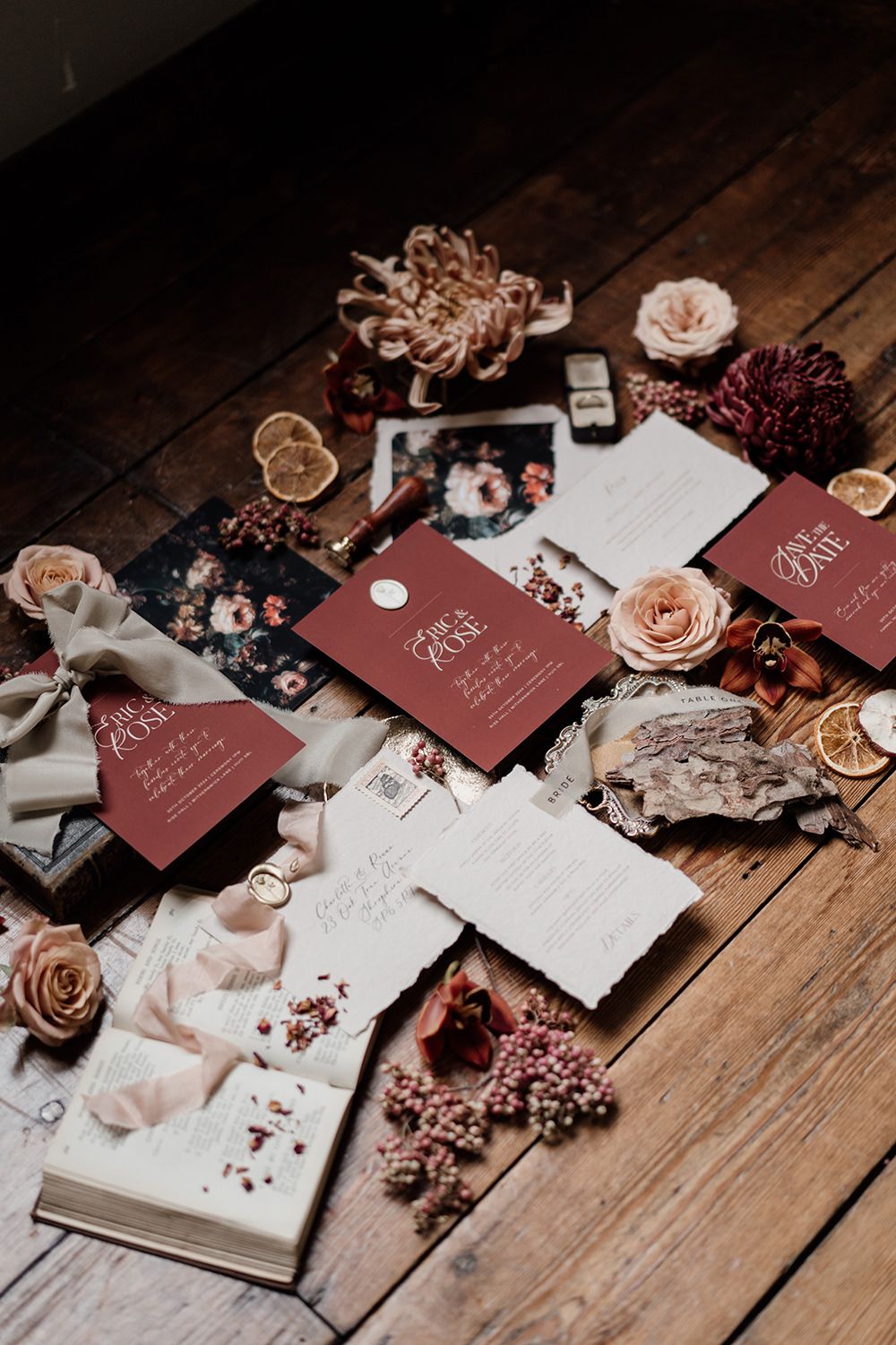 Wedding stationery in burgundy and cream with autumnal colours.