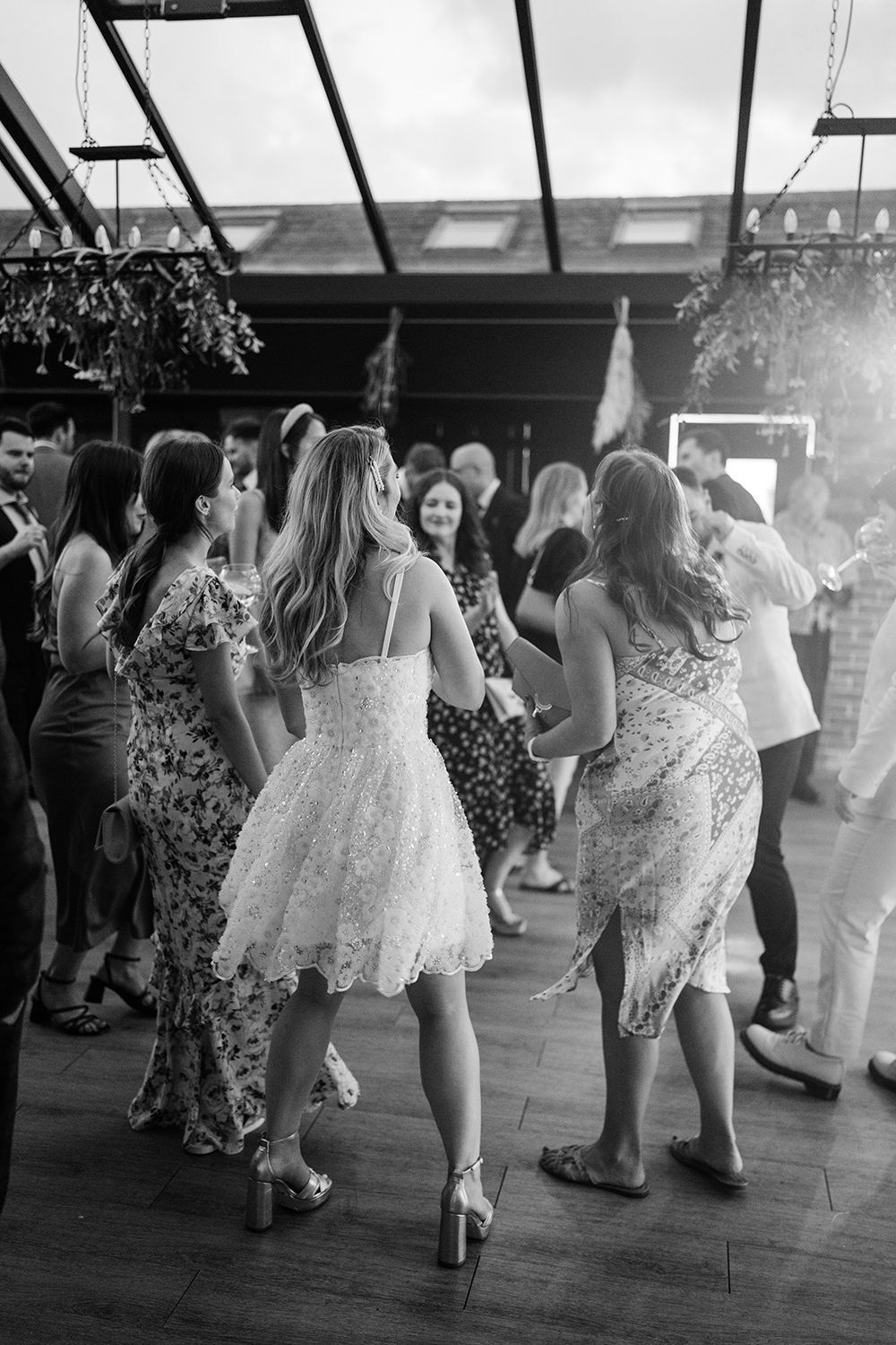 Bride dancing with her friends at the hovels harewood.