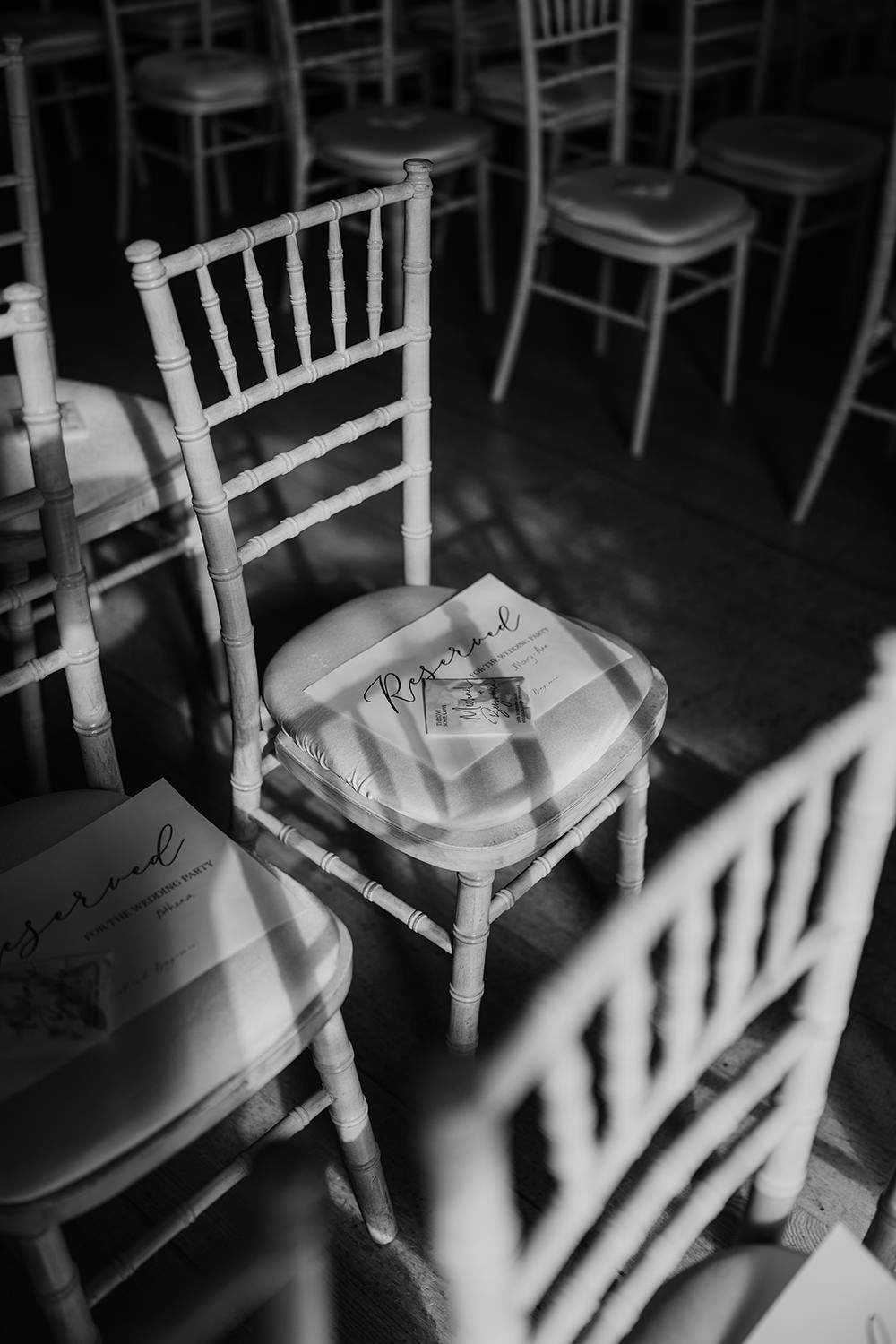 Wedding ceremony details as the light creates dramatic shadows in the main house.