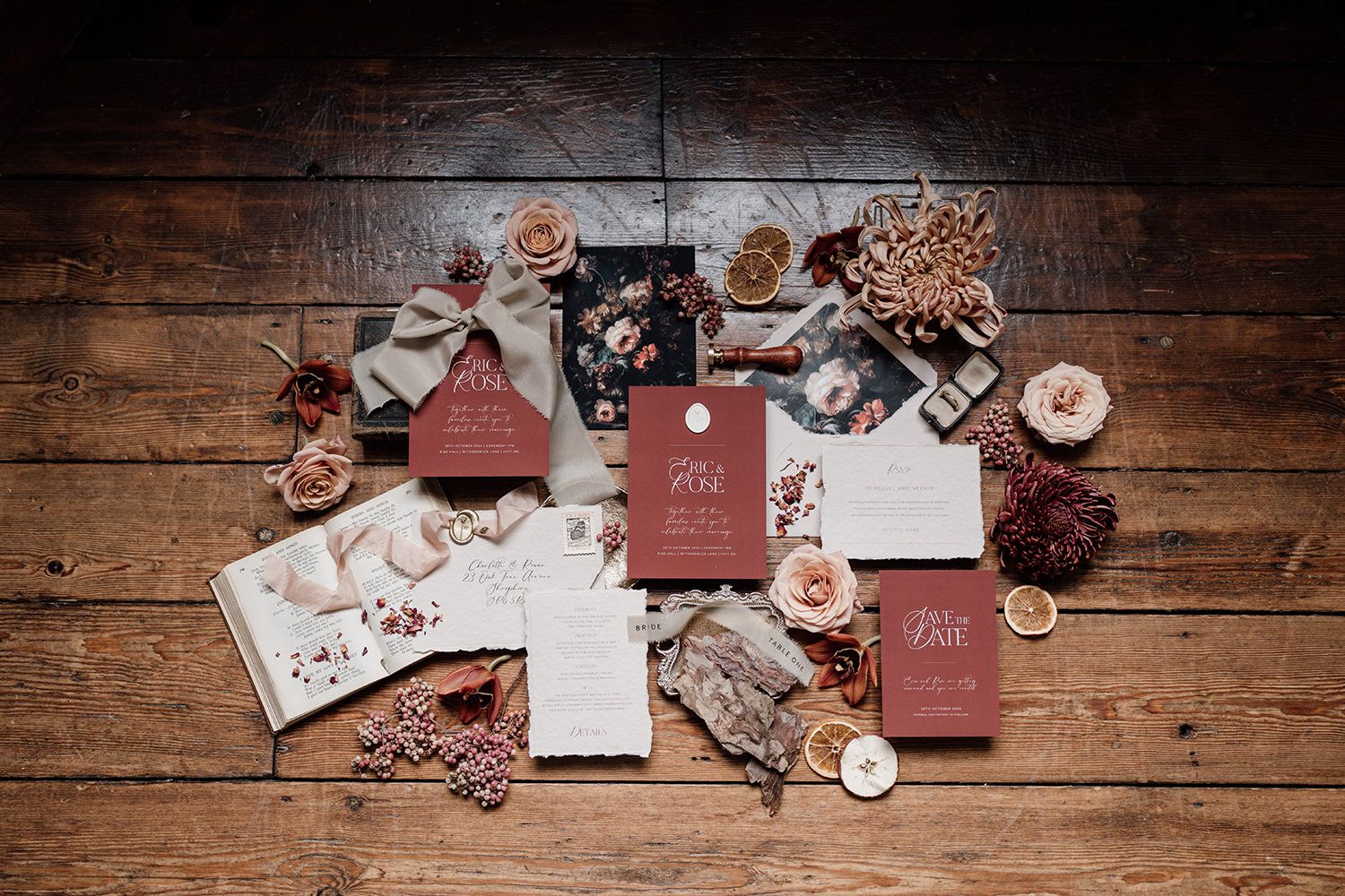 Wedding stationery in burgundy and cream with autumnal colours.