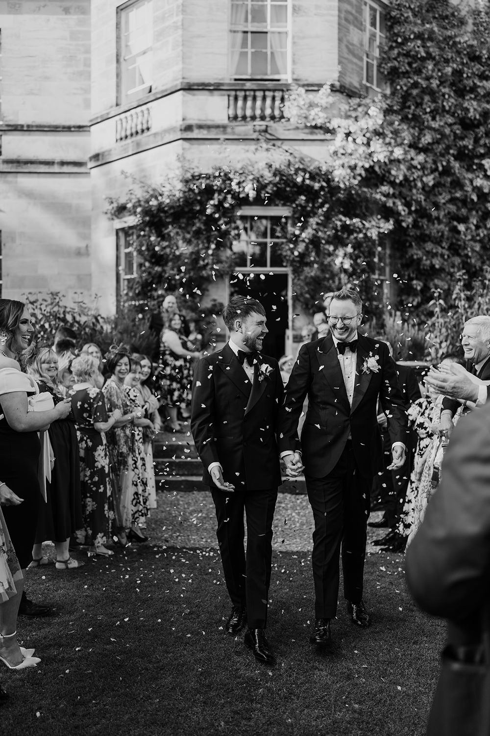Grooms welcomed with confetti by wedding guests at Luxury UK Wedding Venue, Middleton Lodge Estate.