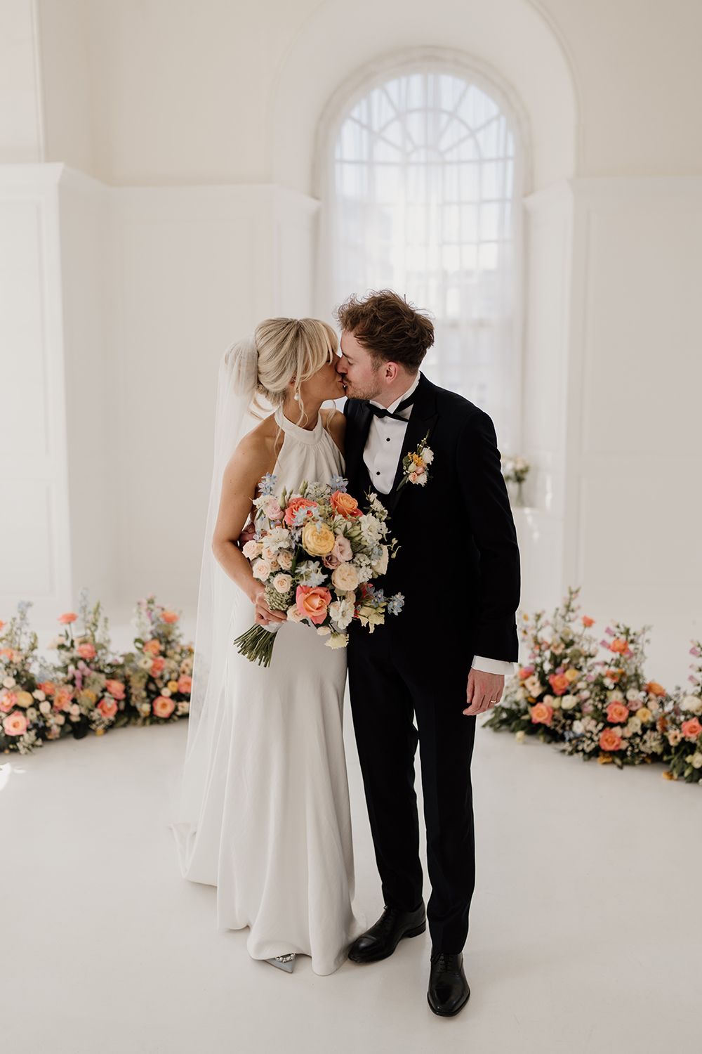 Editorial wedding portraits: Bride and groom in The Secret Tower’s minimalist luxury setting.