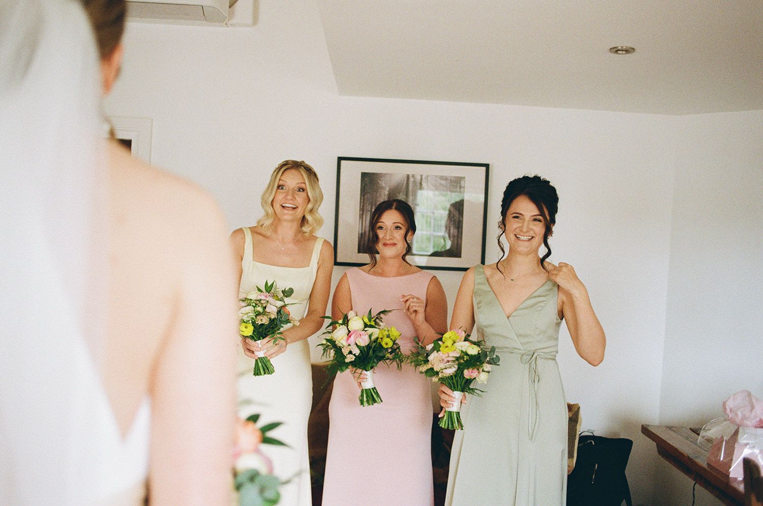 Bridesmaids shocked reaction as they see the bride for the first time.