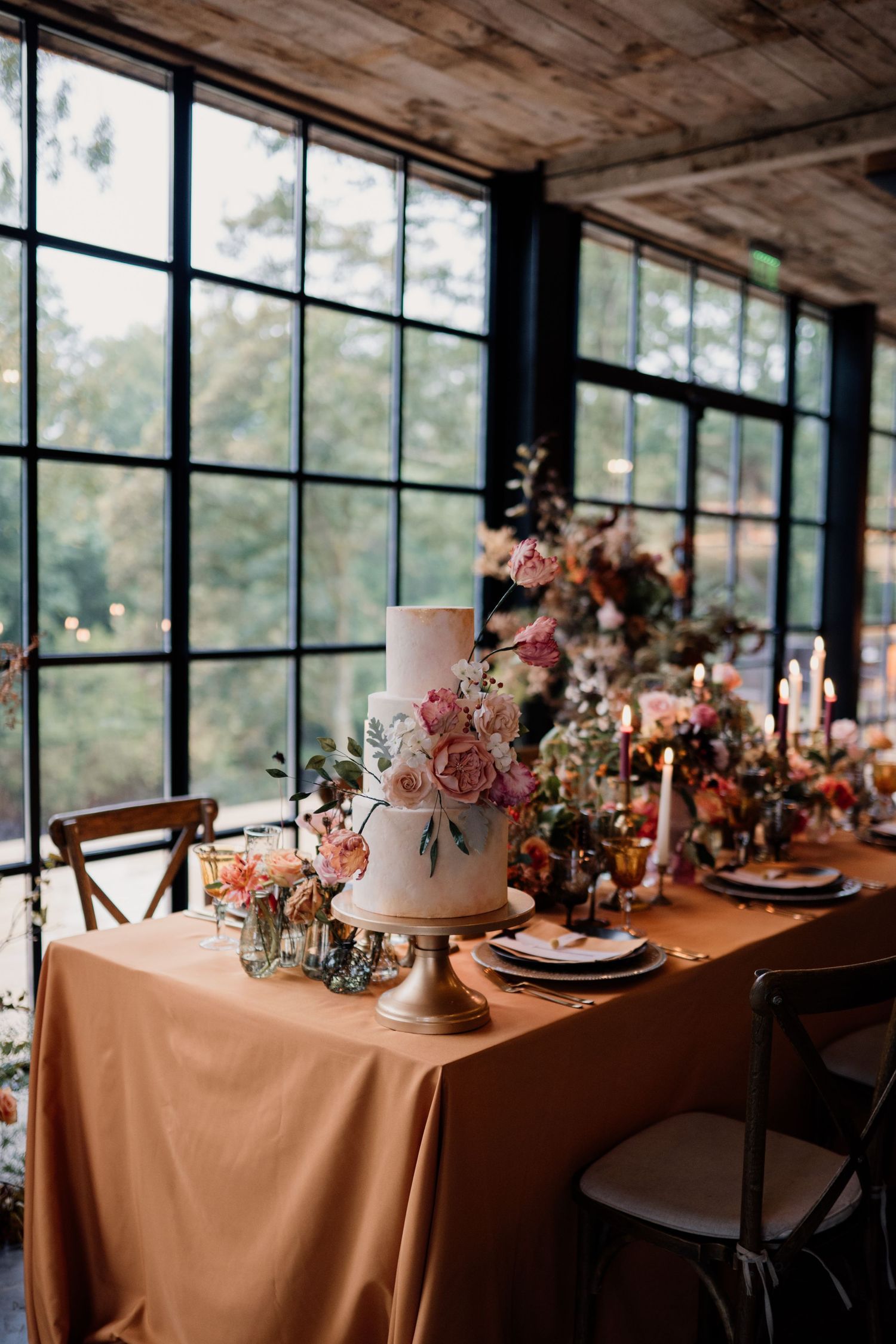 Wedding cake styled on autumnal themed wedding table.