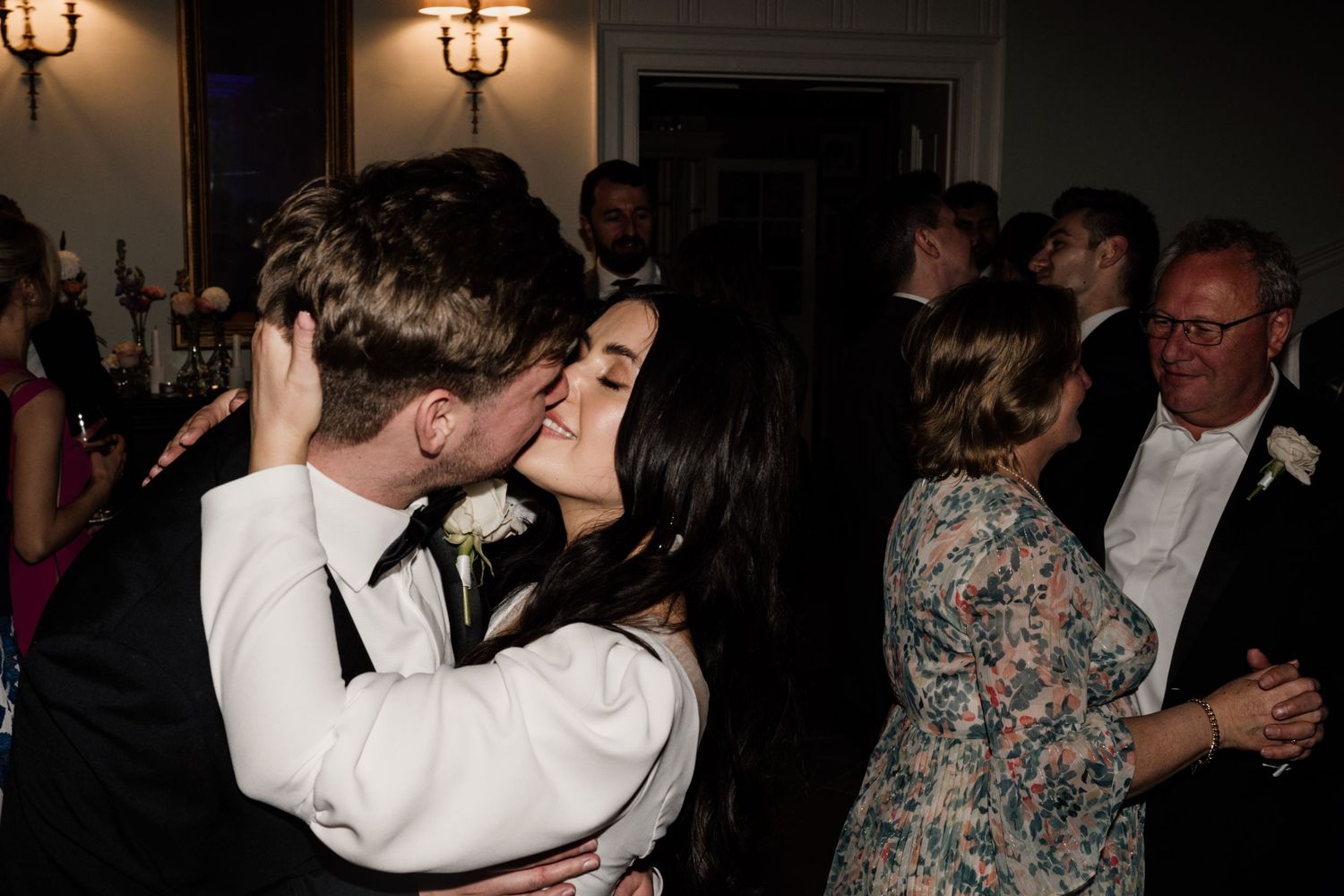 Bride and groom kissing during first dance at Middleton Lodge Estate.