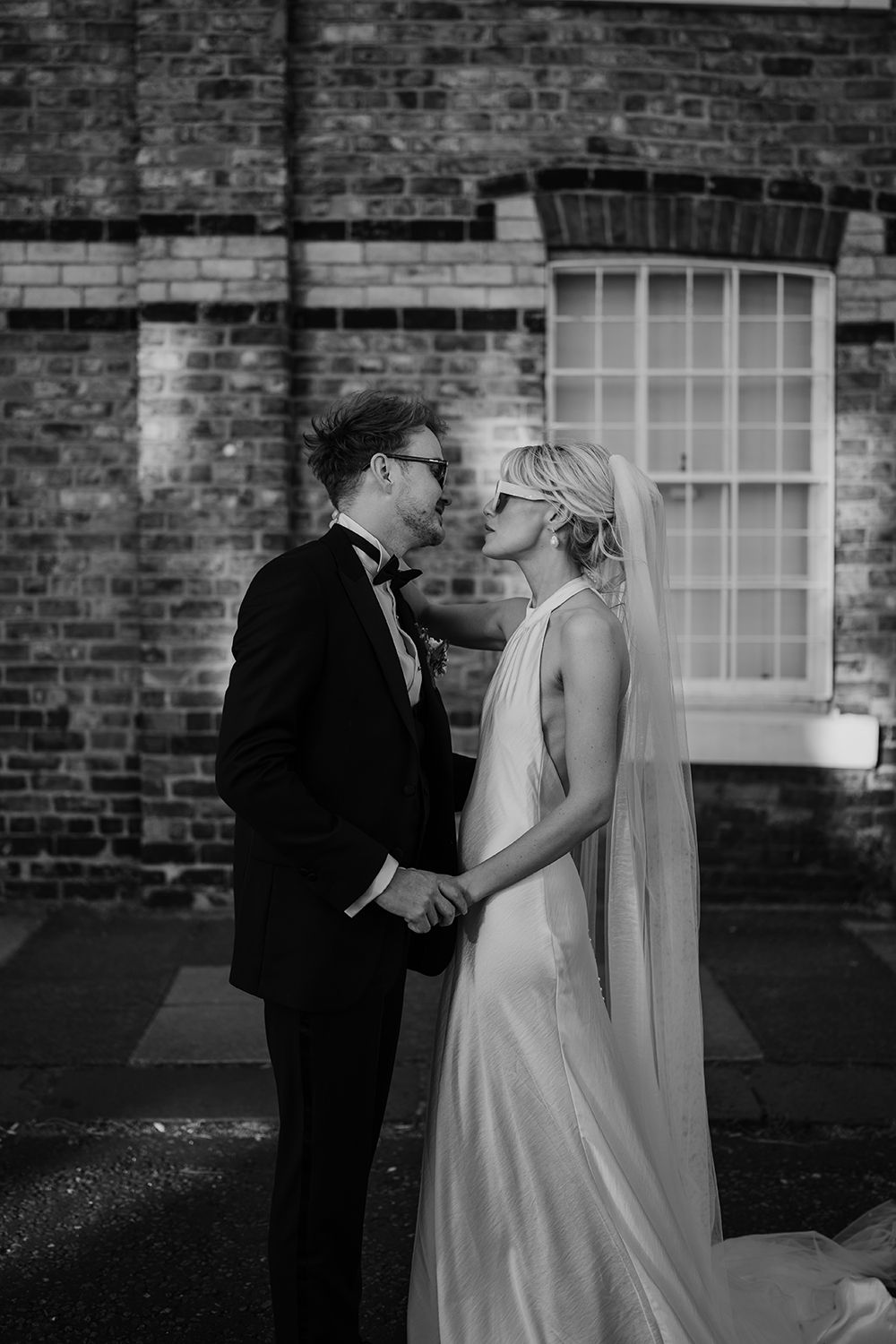Intimate moment: Bride and groom in The Secret Tower’s chic courtyard.