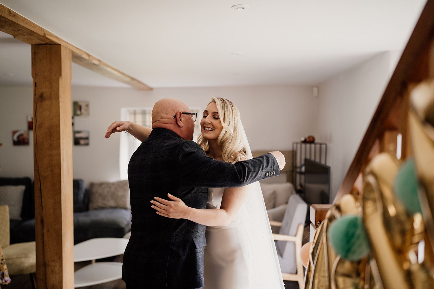 Bride hugging her dad on her wedding morning in the cottage at the Hovels Harewood.