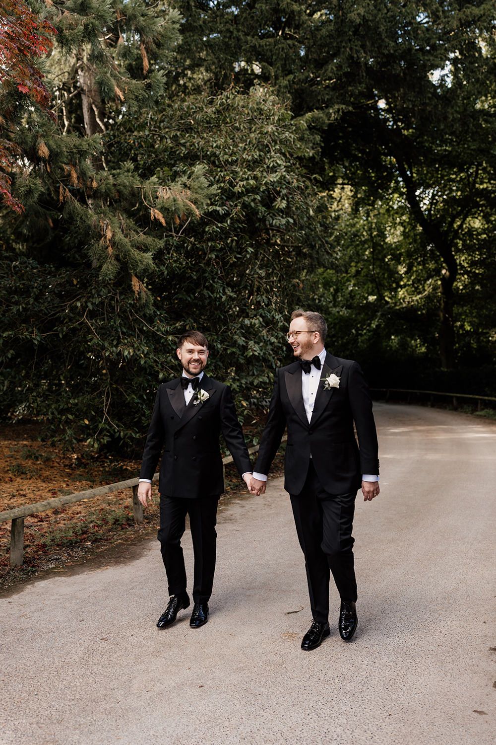 The newlyweds walking hand in hand through the estate’s gardens, making the most of golden hour.