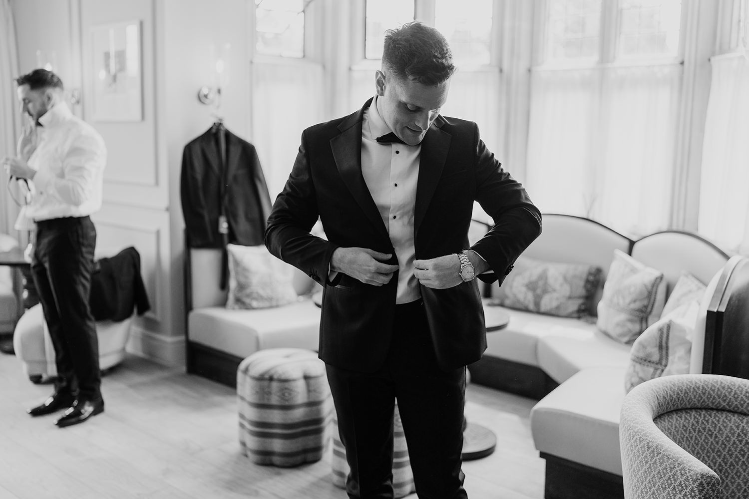 Groom at The Fitz Bar in Kin House as he puts on his wedding suit.