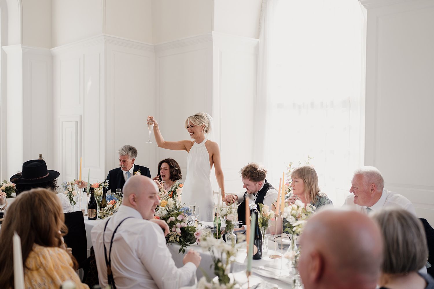 Cheers to love: Guests toasting at a wedding at The Secret Tower Newcastle.