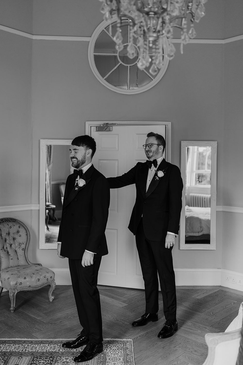 Grooms having their first look together at the main house, Middleton Lodge Estate.