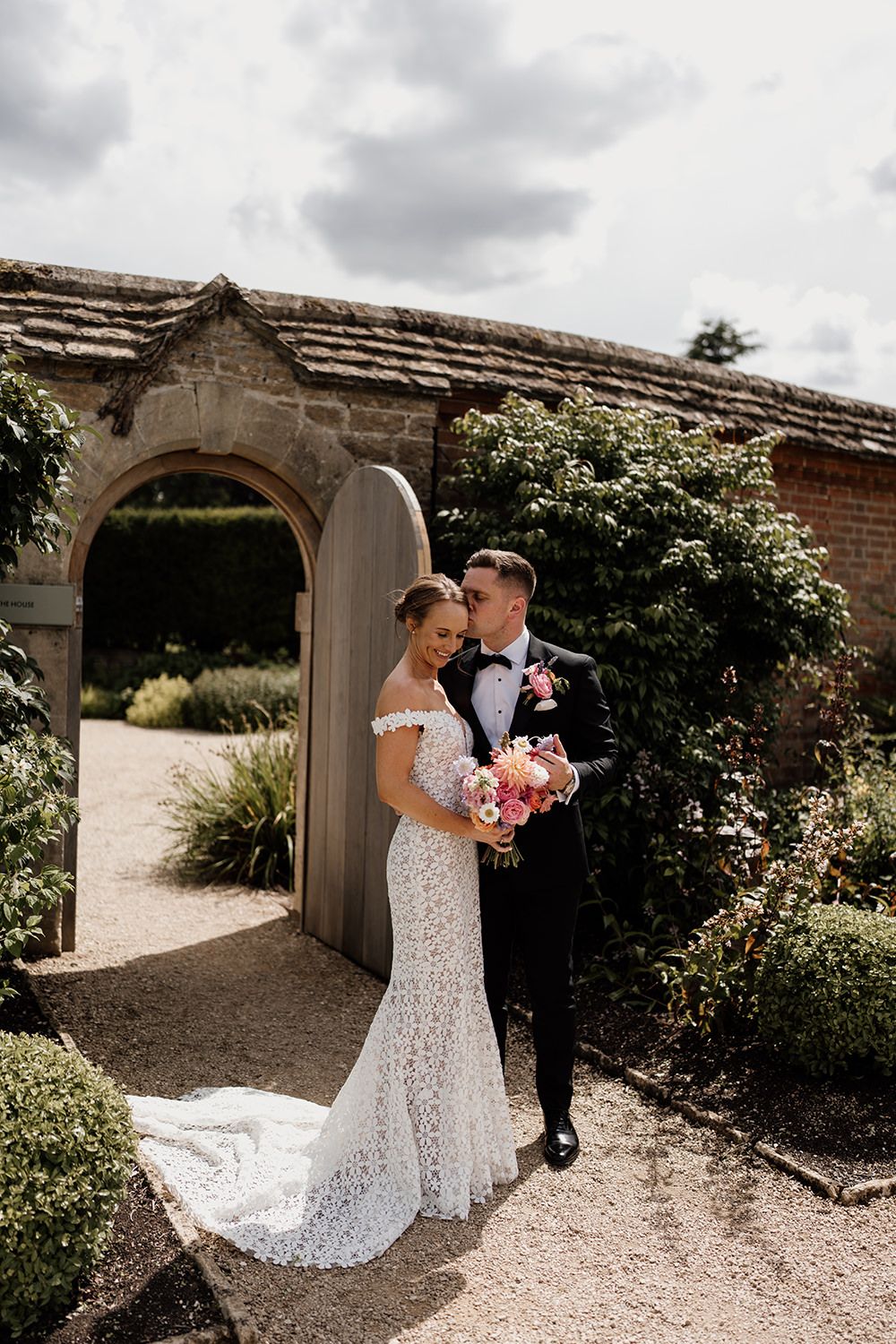 Bride and groom having a quiet moment in the walled gardens together at Kin House.