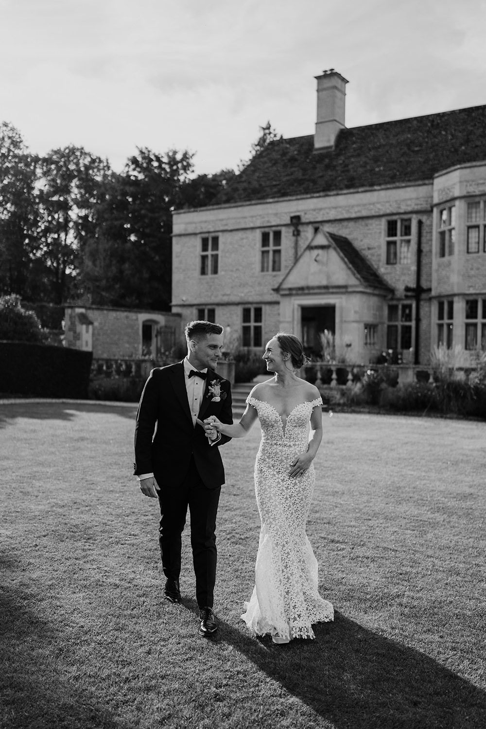 Intimate portrait of the bride and groom sharing a quiet moment together in the walled gardens, Kin House, Cotswolds.