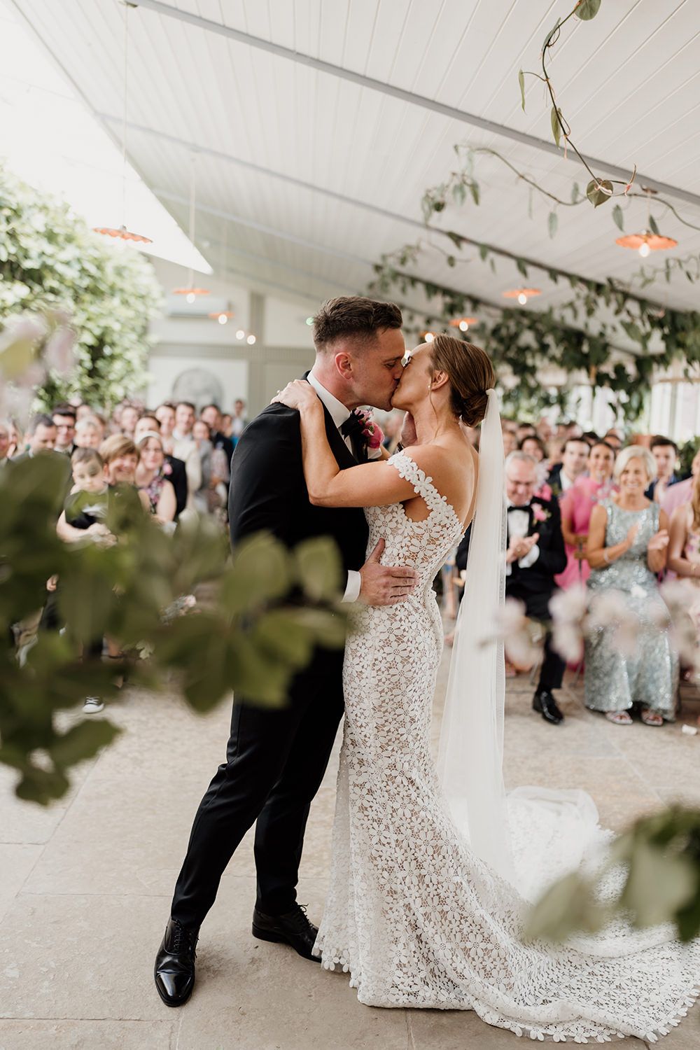 Bride and Groom share their first kiss together at Kin House.