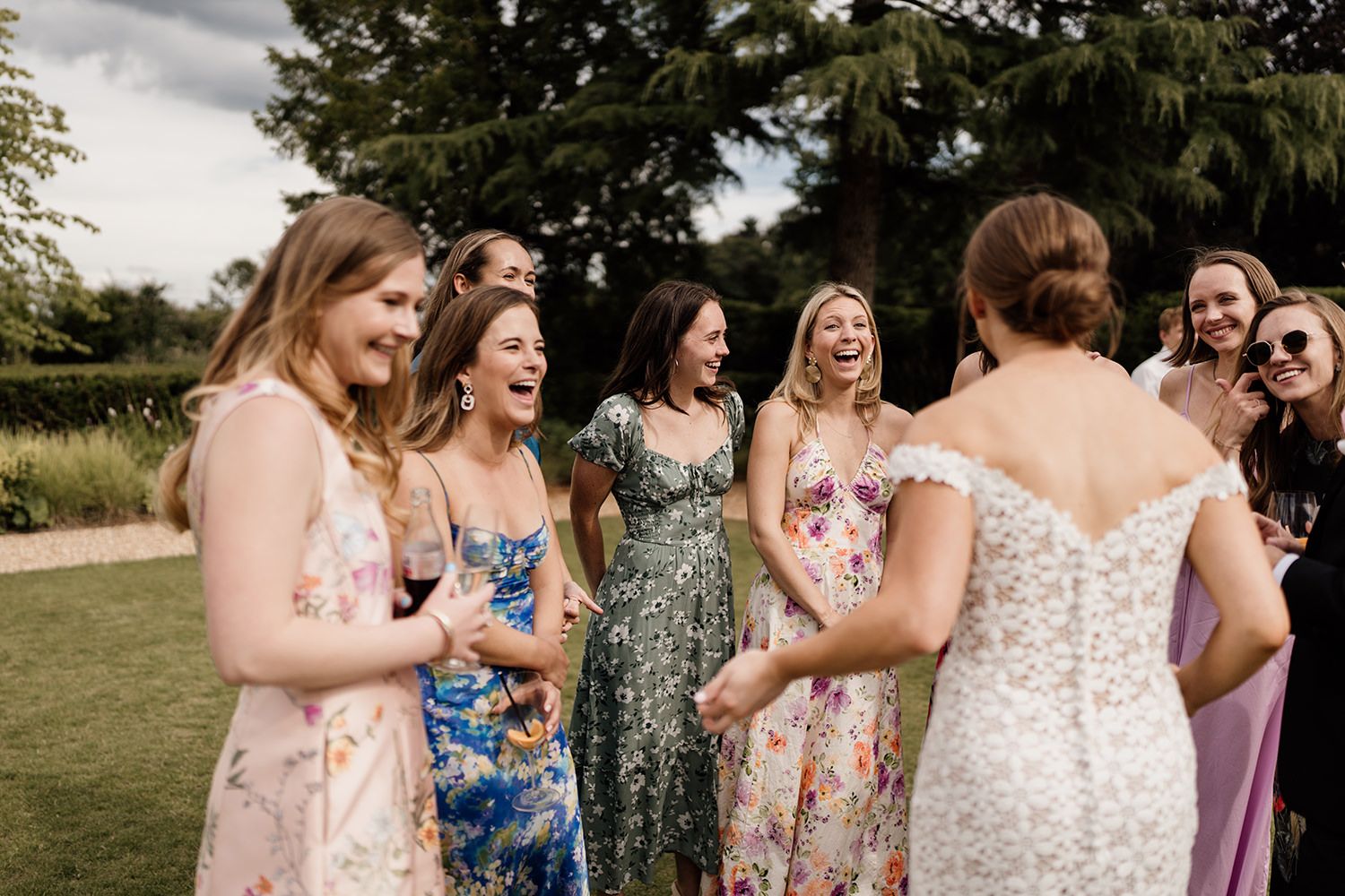 Guests talking and laughing during the wedding reception together.