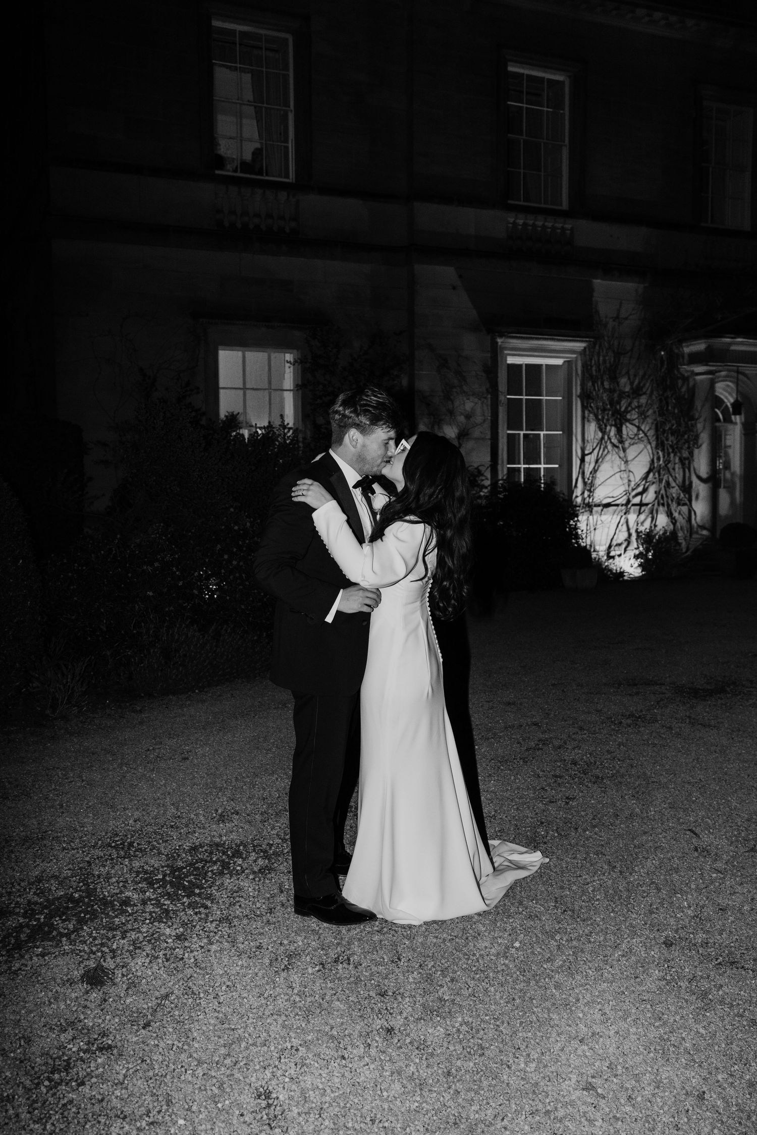 Flash couples portraits at Middleton Lodge Estate with the couple kissing.