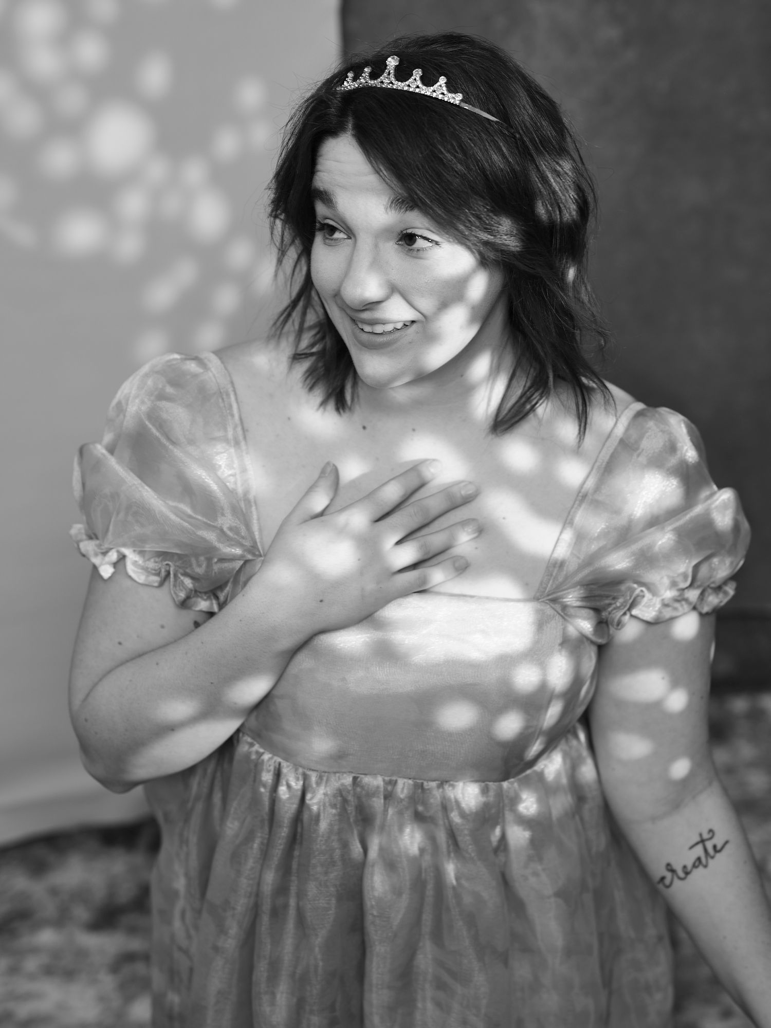 A dreamy portrait with sparkling bokeh lights and a princess-style dress.