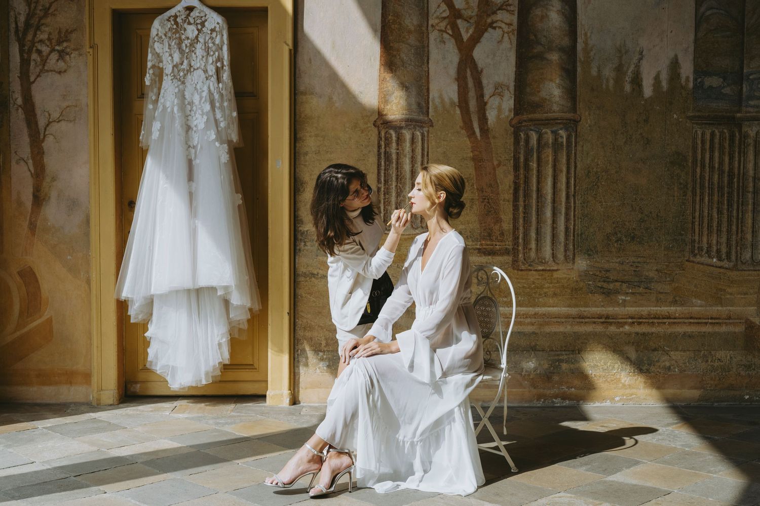 Collage of six elegant wedding dress photos showing white gowns and bridal accessories in vintage-style settings.