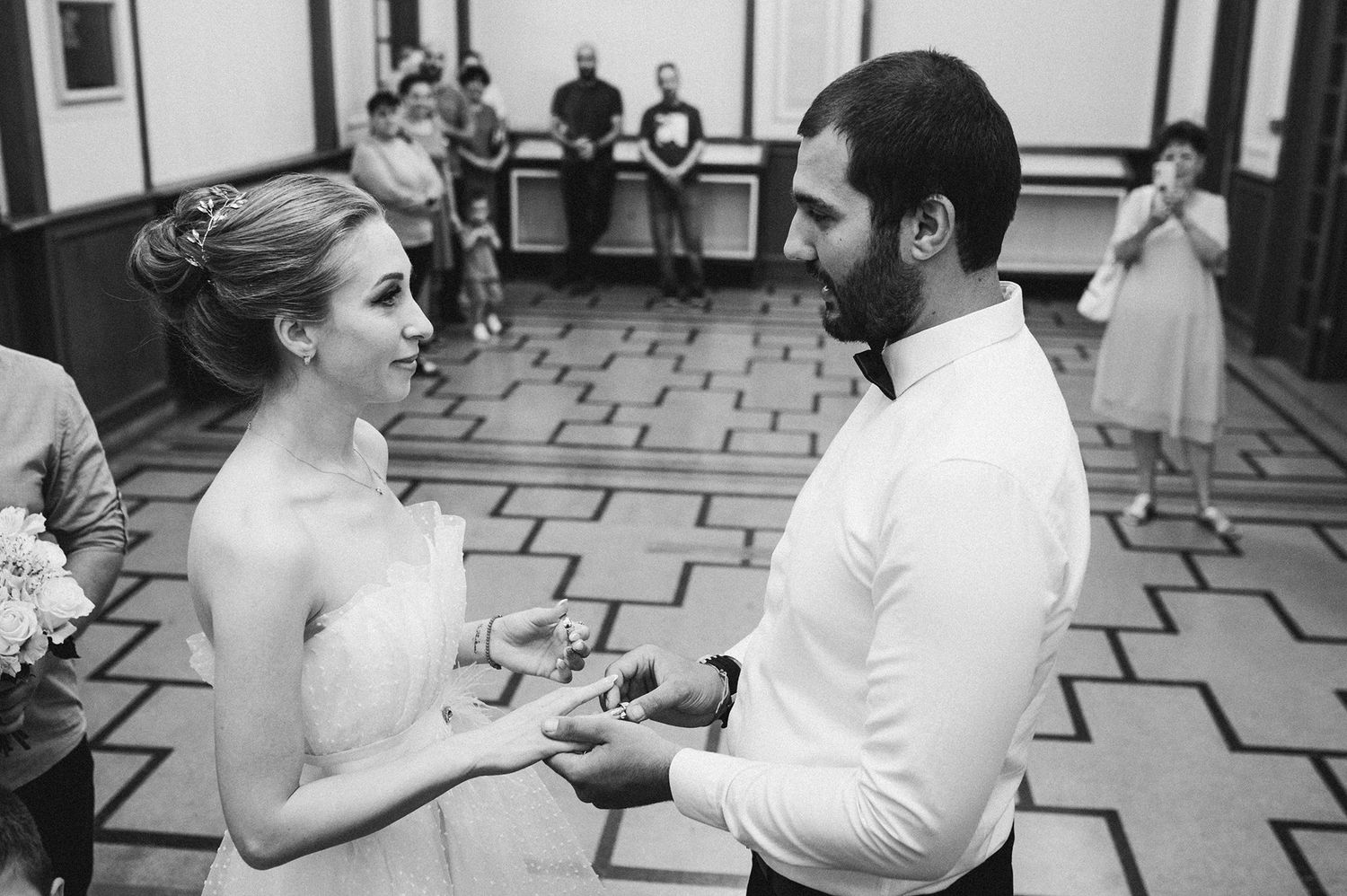 Wedding guests dancing and celebrating at an outdoor venue.