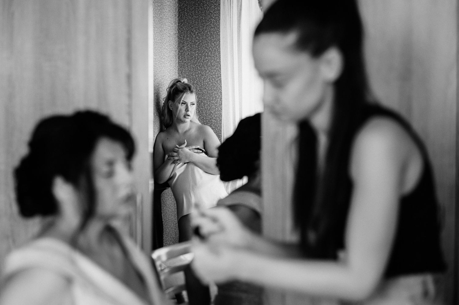 Black and white candid getting ready moments before the wedding ceremony.