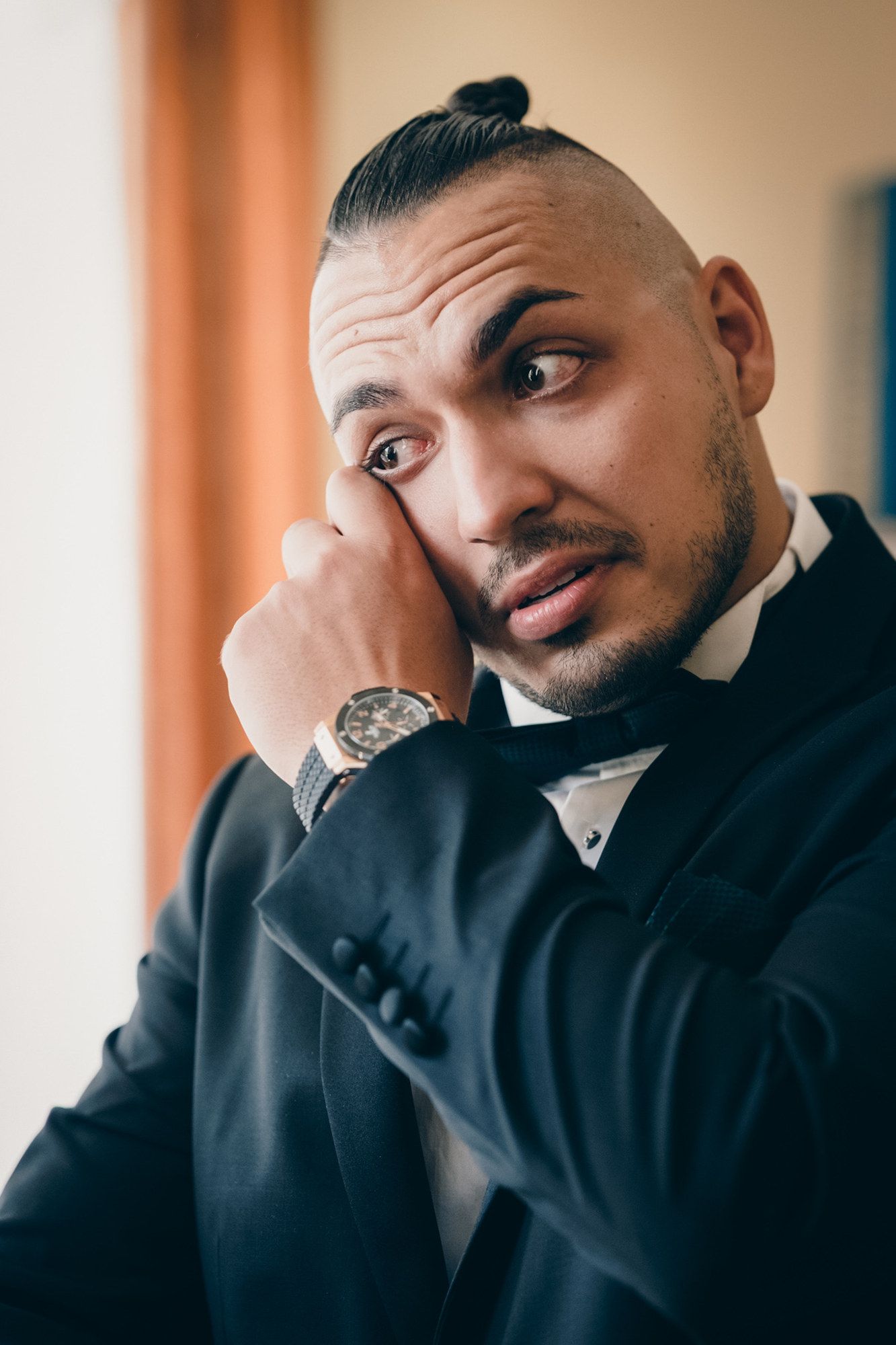 Close-up sequence of expressions showing various emotions in formal attire.