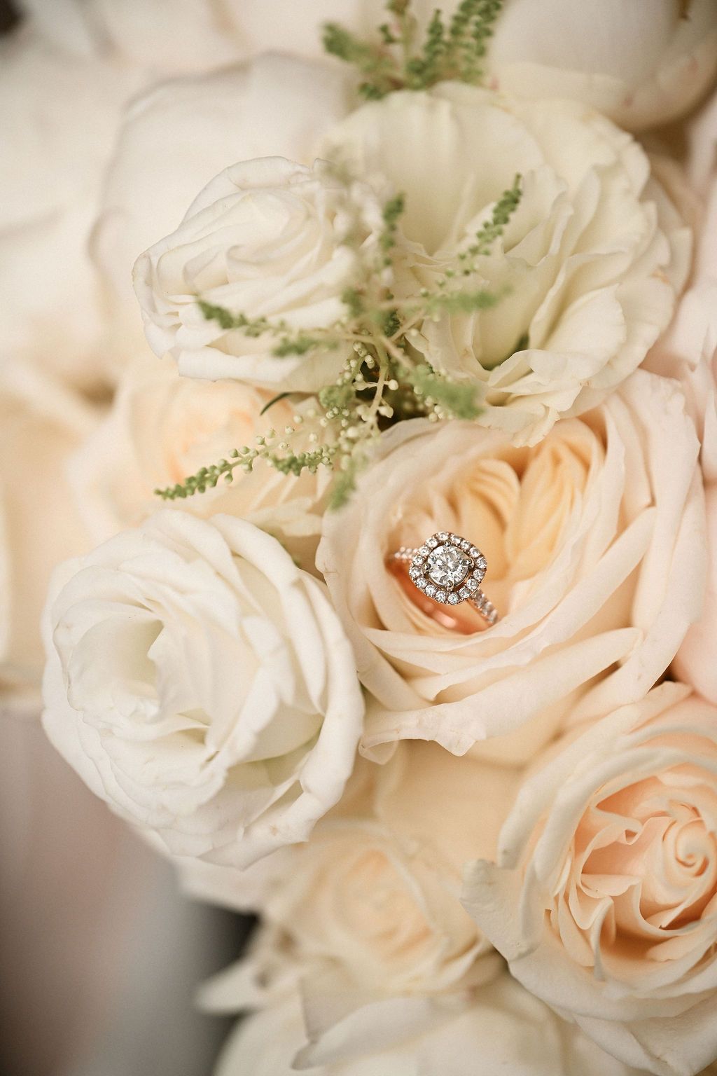 Close-up detail shot of the elegant bridal bouquet paired with a luxury gold wedding ring at a Finca del Canónigo celebration.