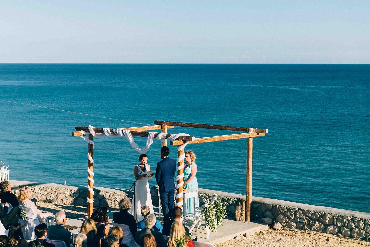 Cinematic view of the wedding ceremony atmosphere on a sunny day in the Cyclades