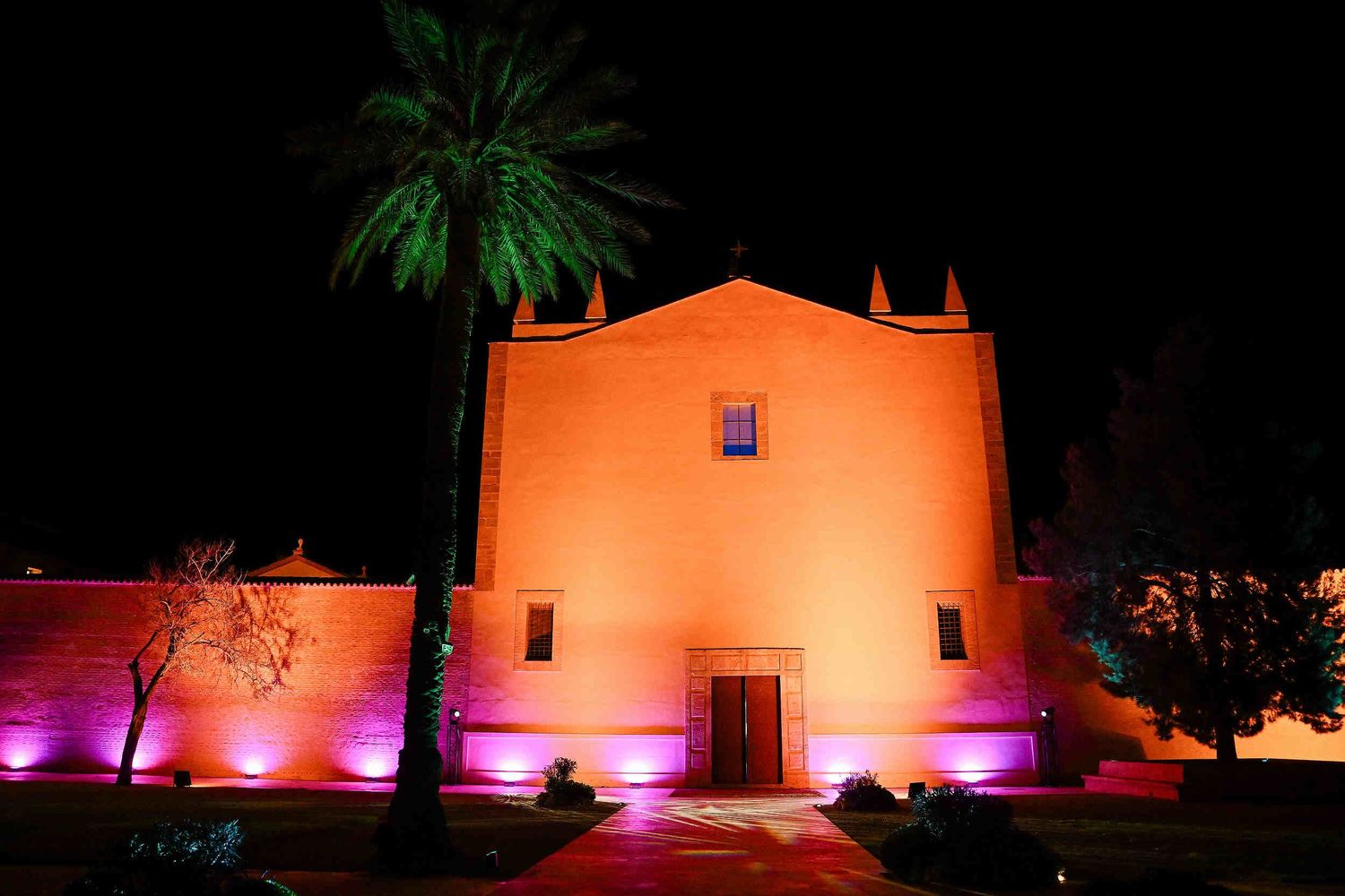 night view of the illuminated La Cartoixa d'Ara Christi monastery at wedding at night