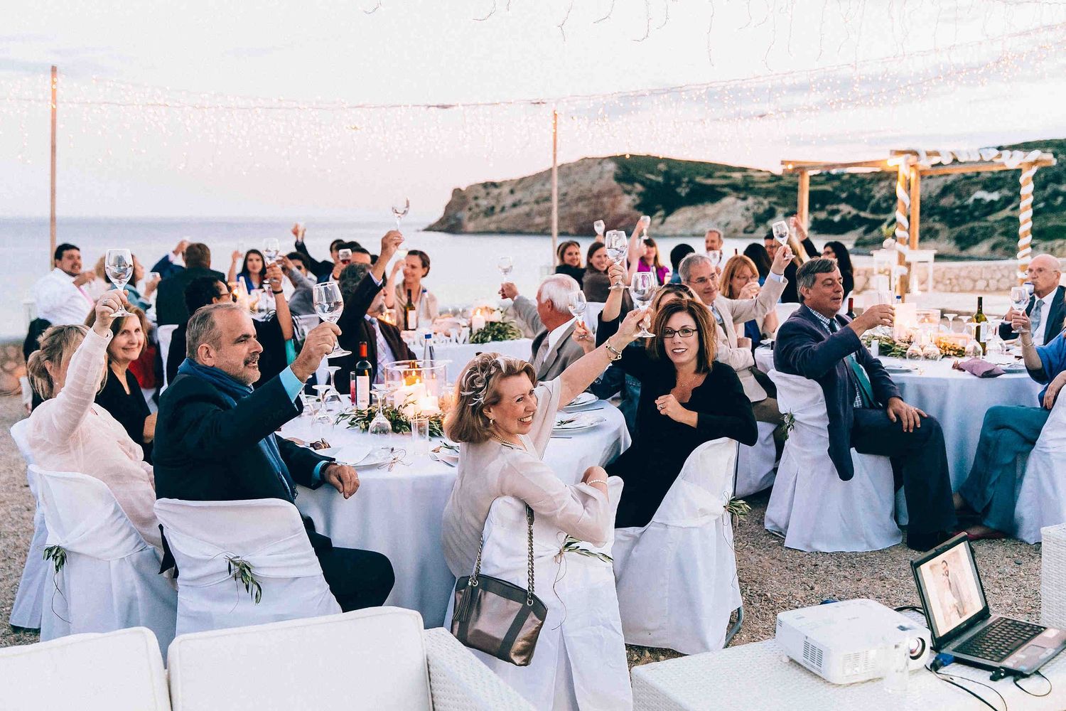 Natural reactions and happy faces of guests during the wedding toasts and speeches.