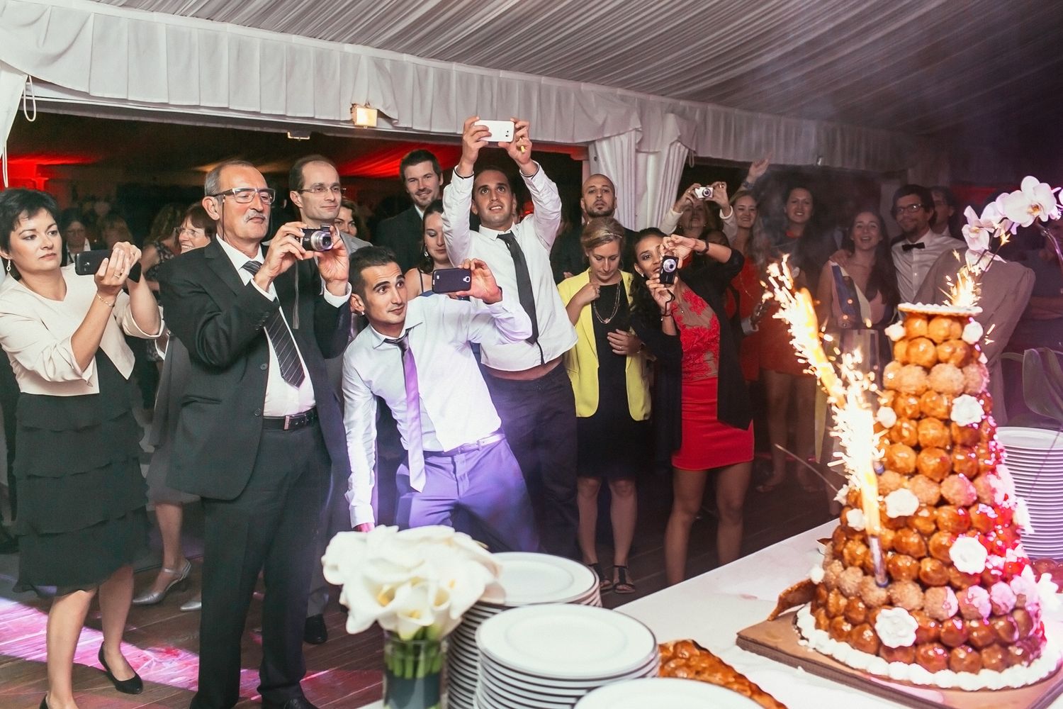 Evening wedding dinner at Château de Changy. Luxury banquet setup with cinematic lighting and warm atmosphere