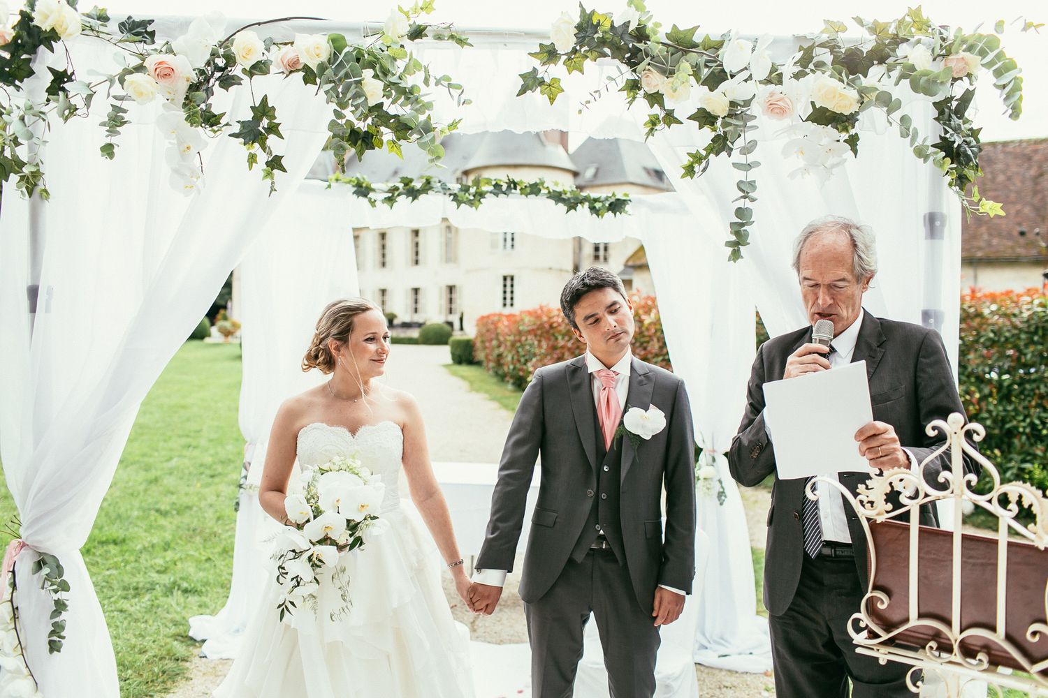 Emotional wedding ceremony at Château de Changy. Candid exchange of vows with raw storytelling and authentic joy