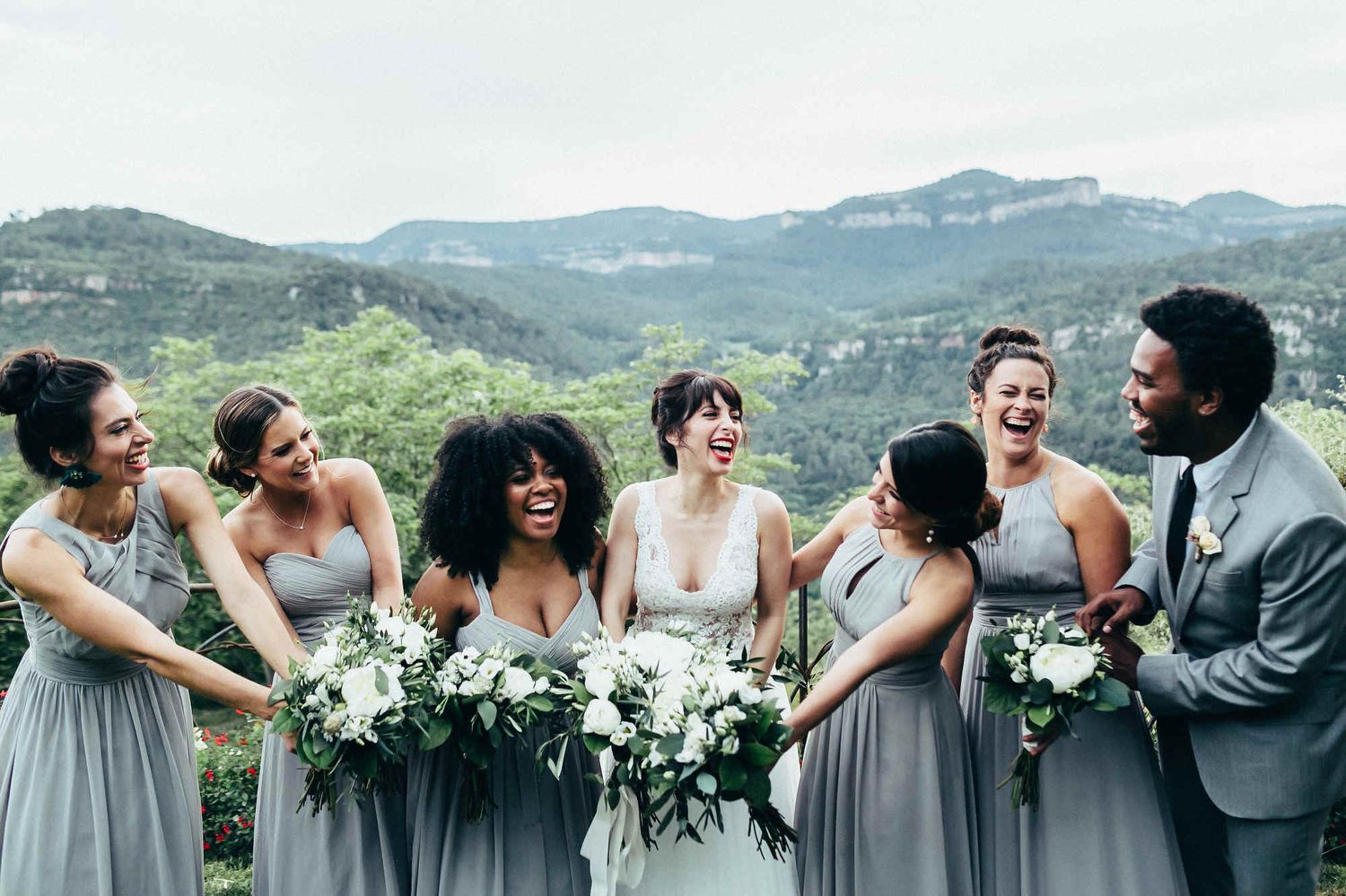 Cinematic mountain wedding ceremony in European village with bride and bridesmaids. Captured by an editorial wedding photographer in Europe
