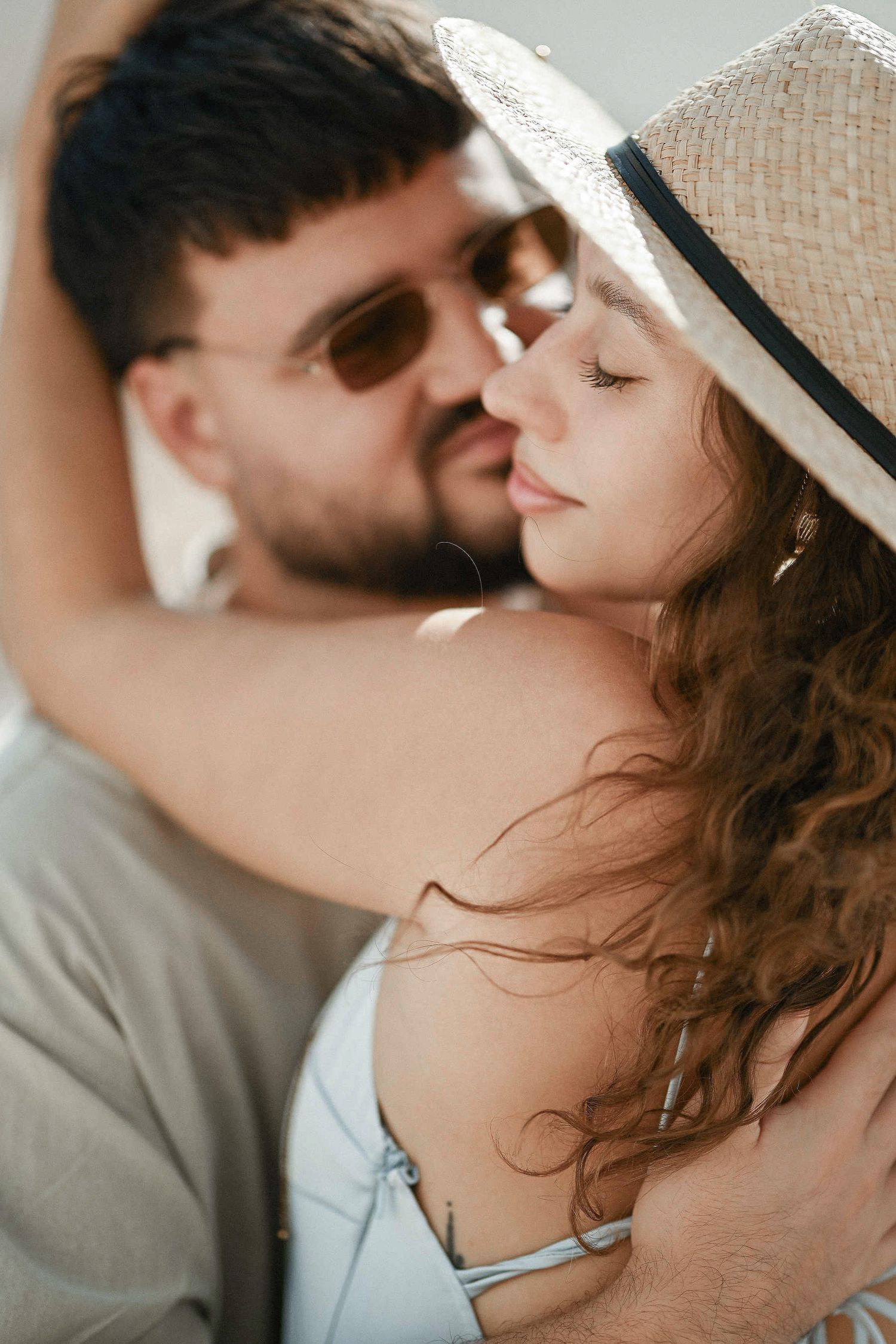An emotional moment as the groom-to-be gazes at his bride-to-be during their engagement session in Altea
