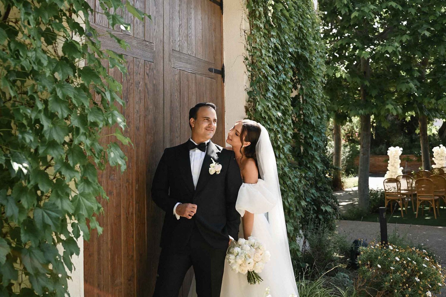 Editorial wedding photography cover of a couple posing in the ancient courtyard of a Spanish villa. Captured by a photographer in Valencia.