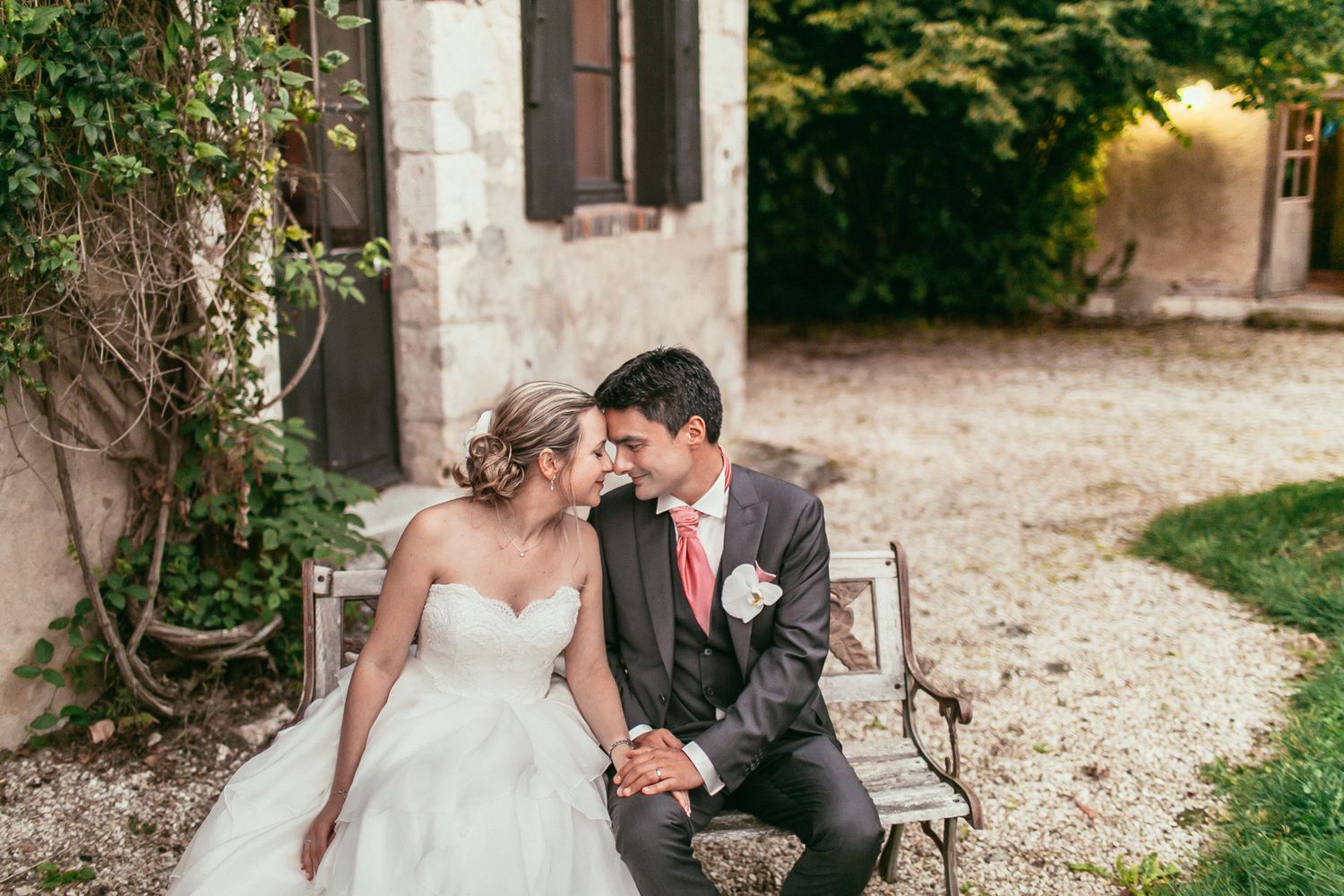 Elegant wedding portrait amidst the manicured hedges of Château de Changy. A blend of nature and French architectural grandeur.
