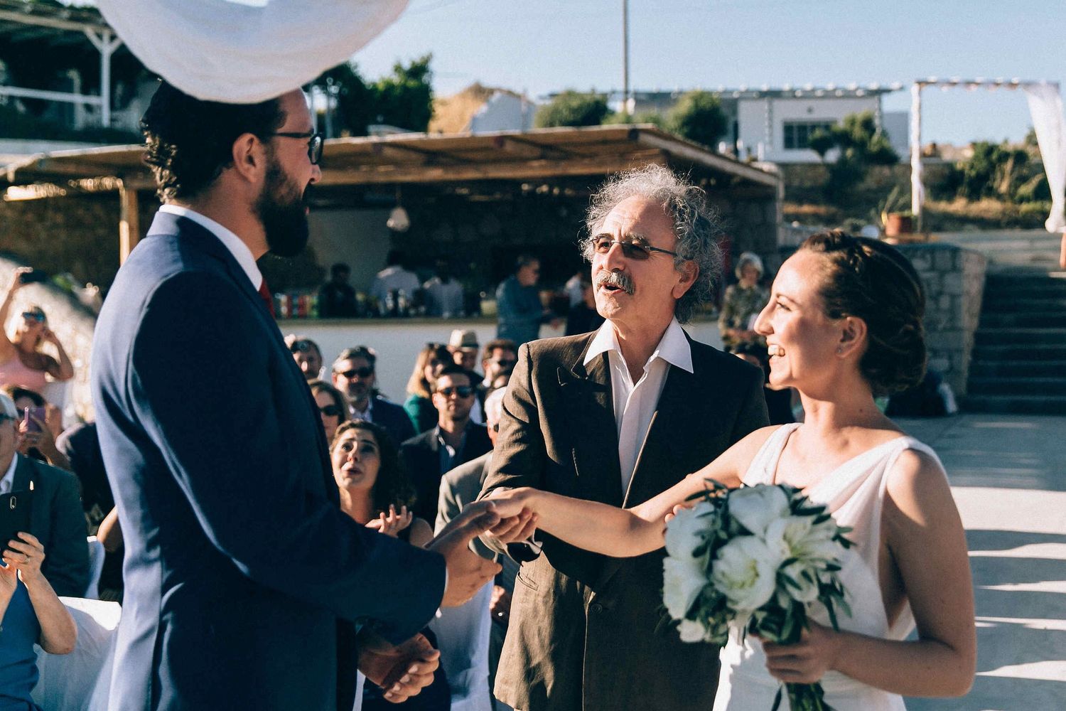 Emotional moment as the father of the bride walks her down the aisle and gives her away